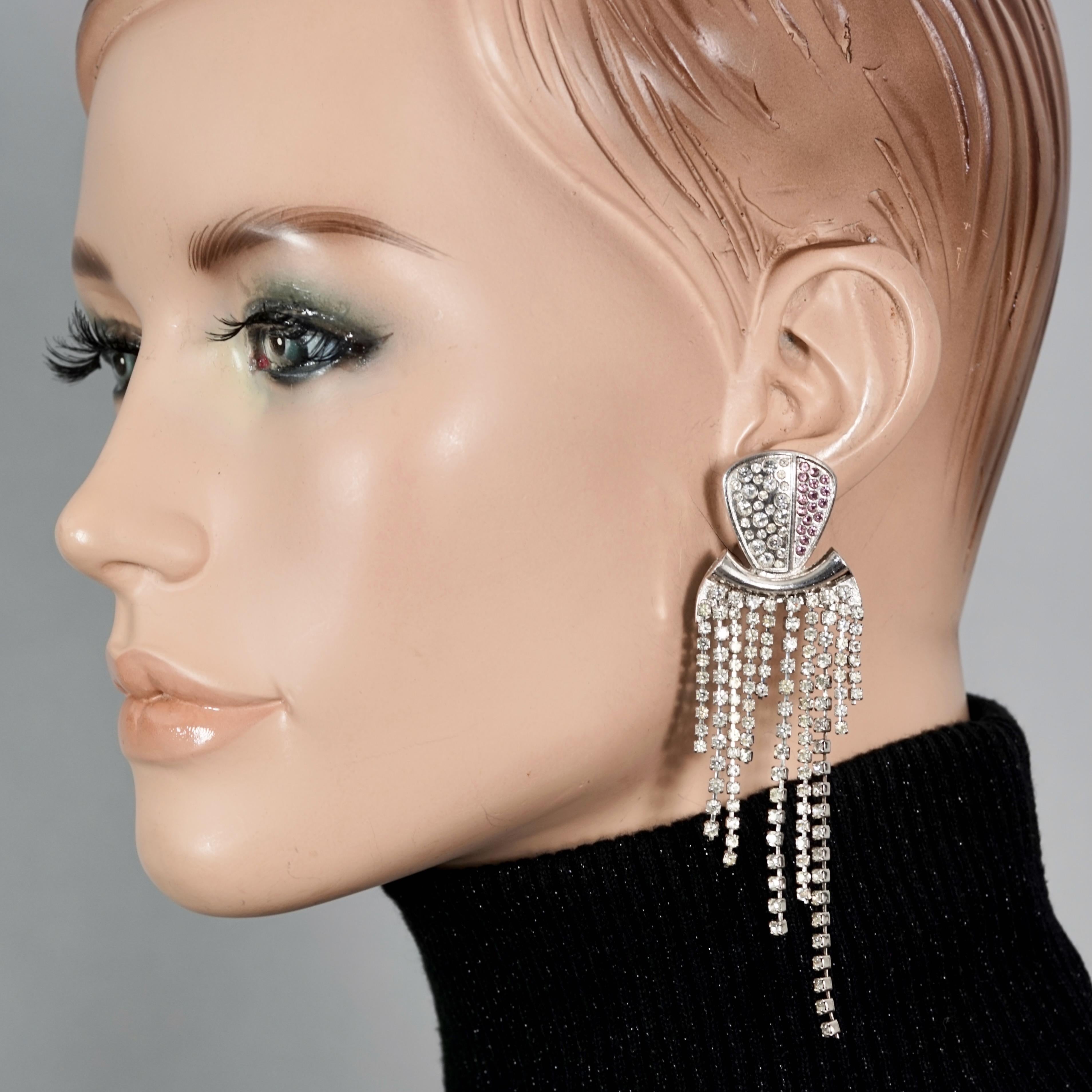 Vintage CHRISTIAN LACROIX Cascading Chain Rhinestone Earrings

Measurements:
Height: 3.94 inches (10 cm)
Width: 1.18 inches (3 cm)
Weight per Earring: 14 grams

Features:
- 100% Authentic CHRISTIAN LACROIX.
- Dangling earrings with cascading