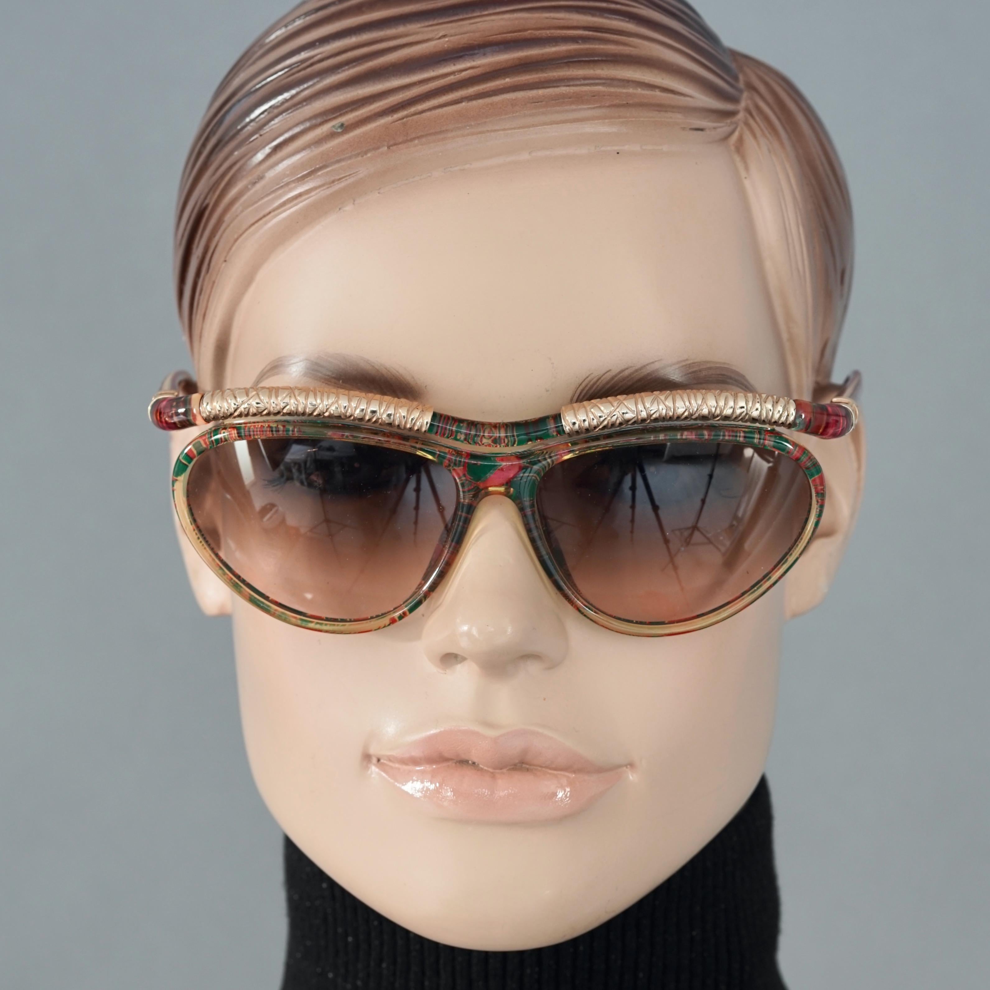 Vintage CHRISTIAN LACROIX Cat Eye Abstract Gilt Accent Sunglasses

Measurements:
Height: 2 inches (5.1 cm)
Horizontal Width: 5.51 inches (14 cm)
Arms: 4.72 inches (12 cm)

Features:
- 100% Authentic CHRISTIAN LACROIX. 
- Cat eye with red and green
