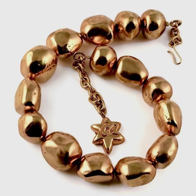 Vintage CHRISTIAN LACROIX Chunky Nugget Bead Necklace

Measurement:
Wearable Length: 15 2/8 inches (38.73 cm) to 17 4/8 inches (44.45 cm)

Features:
- 100% Authentic CHRISTIAN LACROIX.
- Chunky nugget metal beads.
- Gold tone.
- Adjustable hook