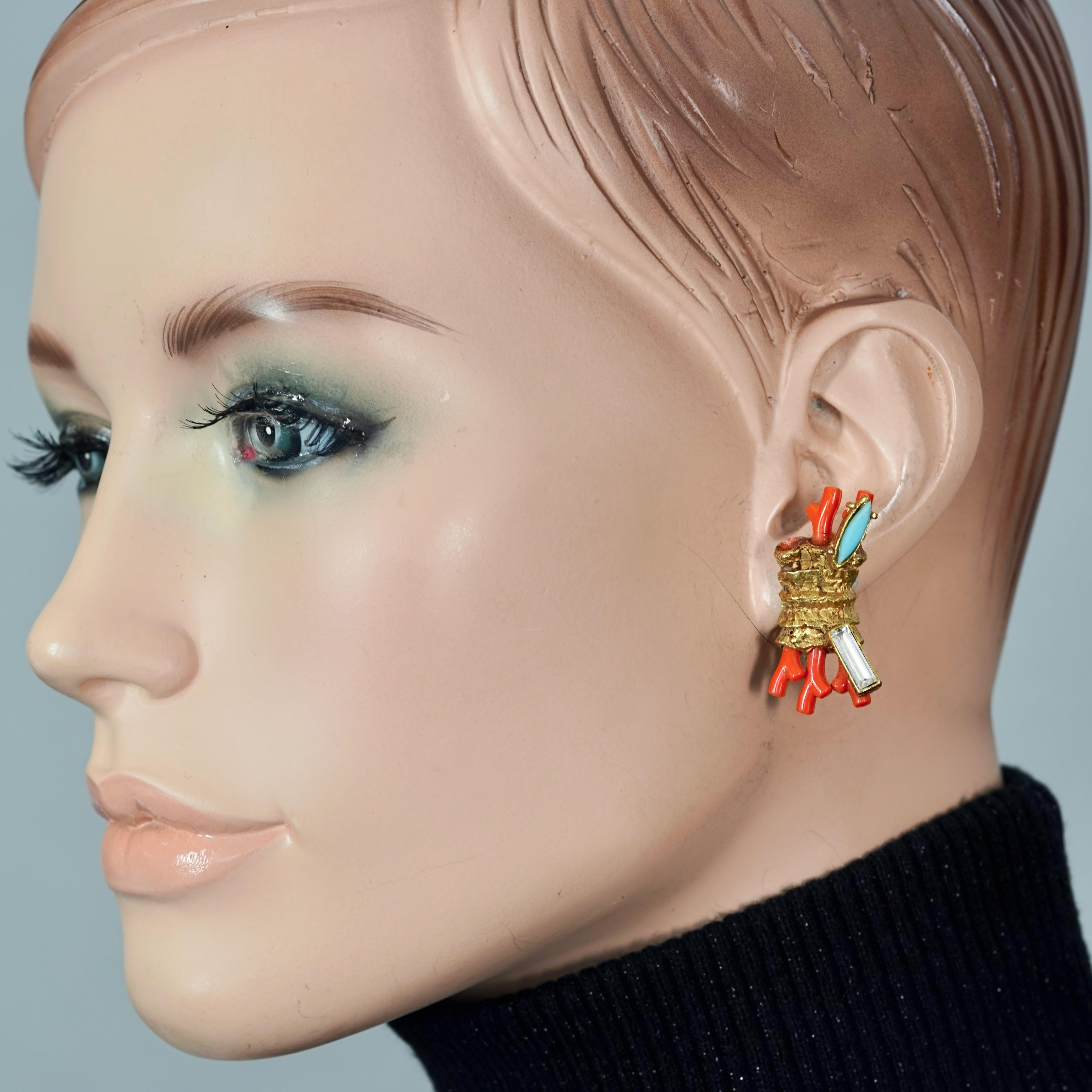 Vintage CHRISTIAN LACROIX Coral Turquoise Rhinestone Earrings

Measurements:
Height: 1.38 inches (3.5 cm)
Width: 0.75 inch (1.9 cm)
Weight per Earring: 9 grams

Features:
- 100% Authentic CHRISTIAN LACROIX.
- Gilt textured earrings with sculptured