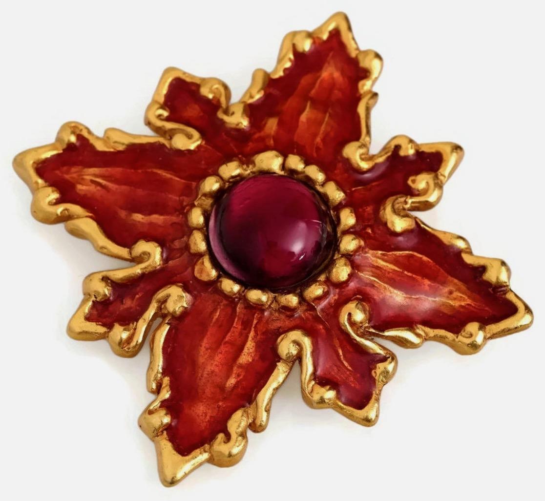 Vintage CHRISTIAN LACROIX Flower Enamel Poured Glass Brooch

Measurements:
Height: 3 2/8 inches
Width: 3 2/8 inches

Features:
- 100% Authentic CHRISTIAN LACROIX.
- Flower brooch embellished with red glass poured/ glass cabochon.
- Orange enamel