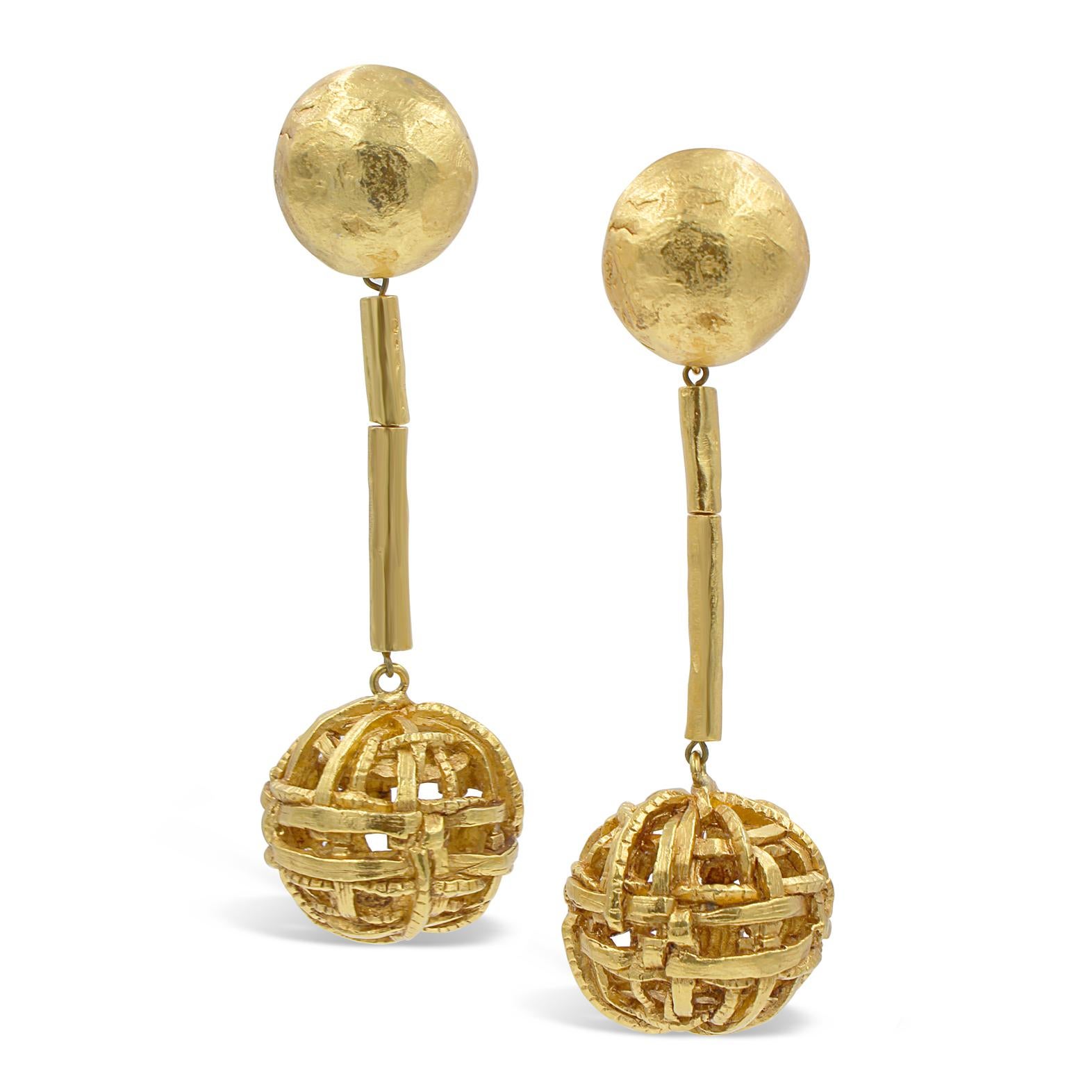 Vintage Christian Lacroix Gold Tone Dangling Ball Earring with 2 Bars of Metal that can be Manipulated with Ball attached at the End.  So Lacroix!
These are very chic. They have a look about them without screaming, but when you see them on, wow.