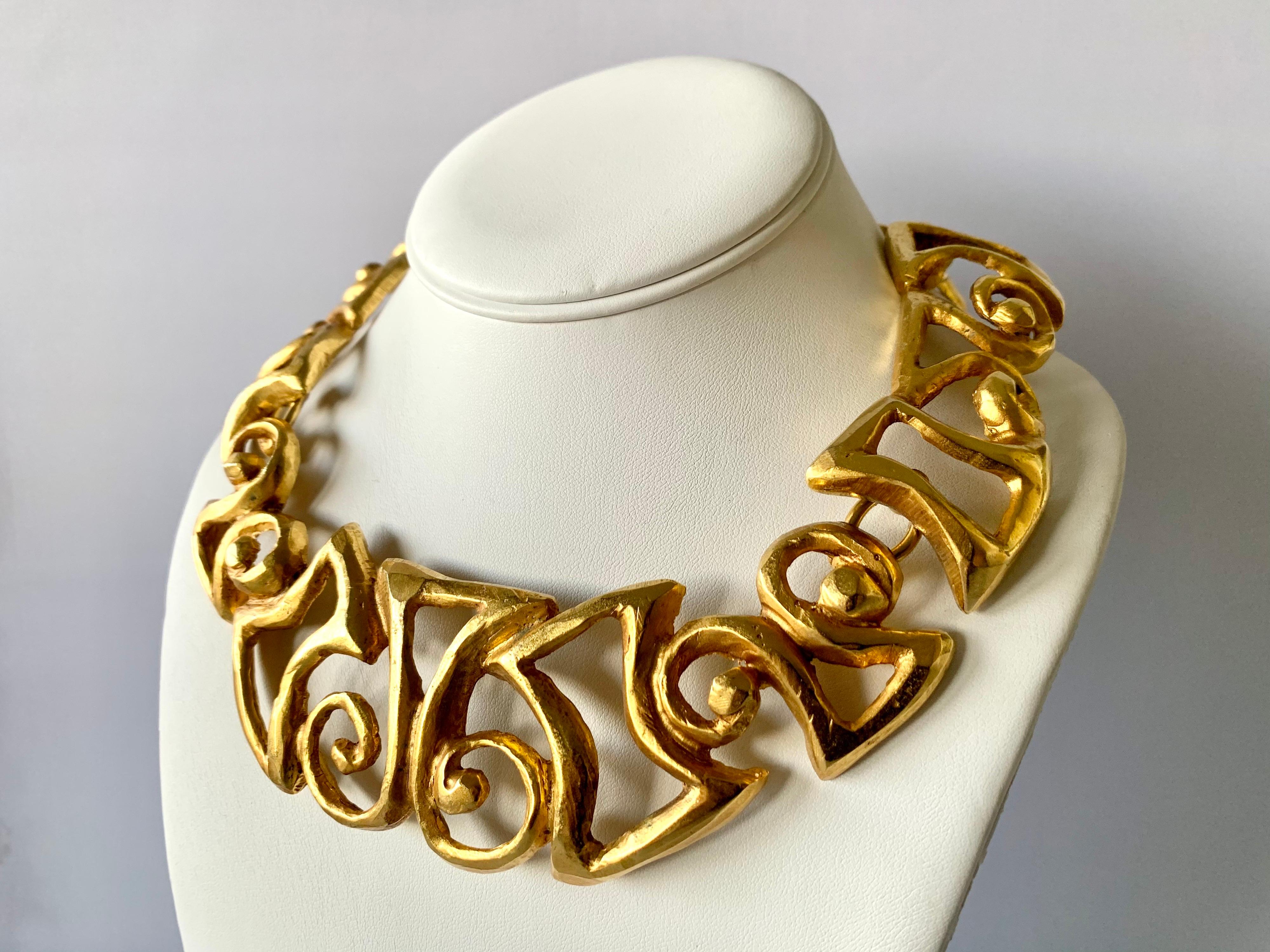Vintage Christian Lacroix articulated gold-tone chunky statement necklace featuring a contemporary scroll tribal design - made in Paris circa 1990s.