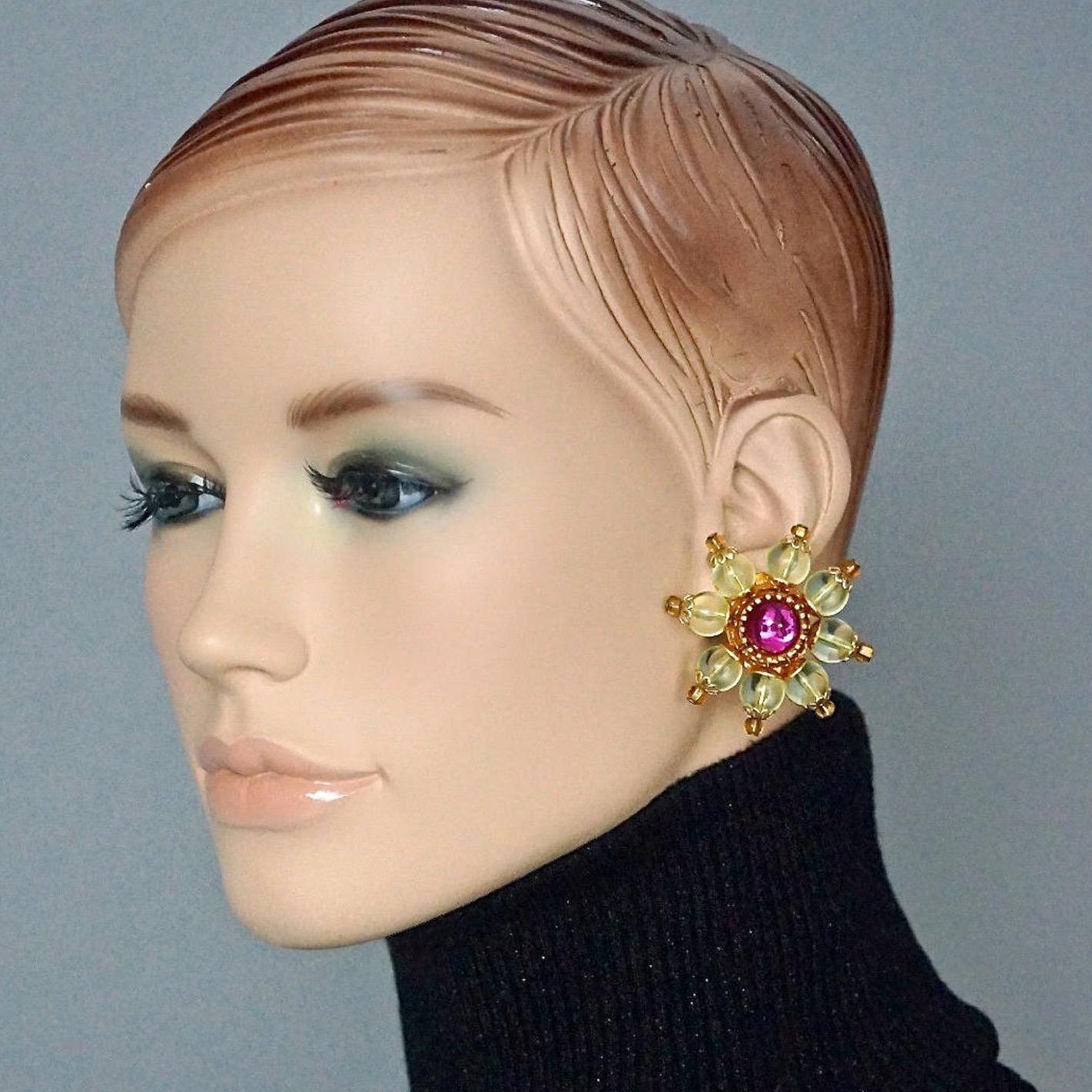 Vintage CHRISTIAN LACROIX Lucite Flower Bead Cabochon Earrings

Measurements:
Height: 1.81 inches (4.6 cm)
Width: 1.81 inches (4.6 cm)
Weight per Earring: 17 grams

Features:
- 100% Authentic CHRISTIAN LACROIX.
- Large lucite flower in yellow resin