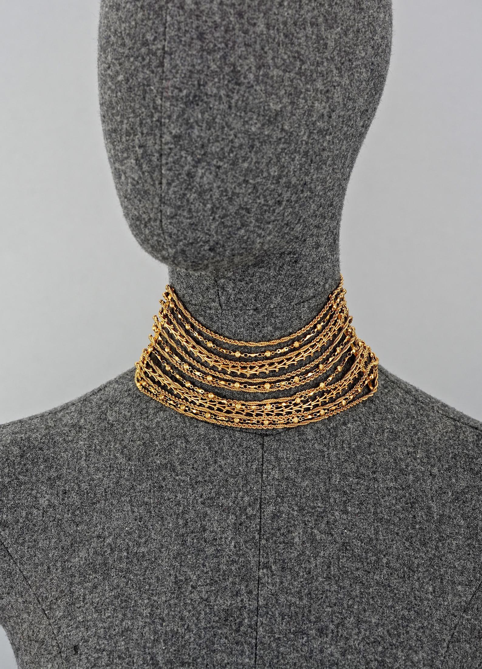 Vintage CHRISTIAN LACROIX Masai Multi Strand Chain Choker Necklace

Measurements:
Height: 2.75 inches (7cm)
Wearable Length: 12.99 inches (33 cm) to 13.38 inches (34 cm)

Features:
- 100% Authentic CHRISTIAN LACROIX.
- 13 strands of chain in