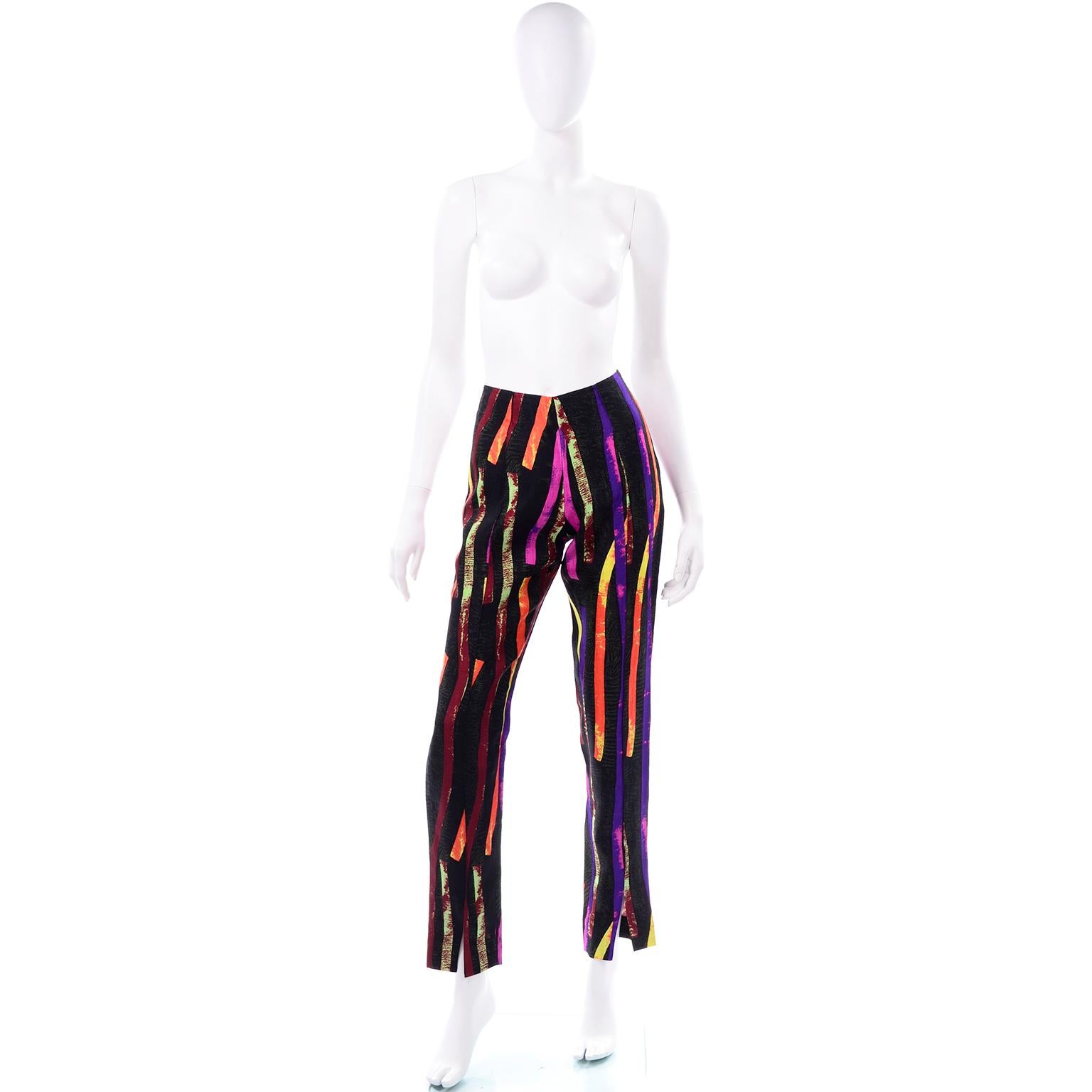 These are incredible vintage Christian Lacroix silk / cotton blend bold print pants. These fabulous vintage pants have a black background with mottled strips of orange, purple, fuchsia and lime green. These pants close with a side zipper and hook