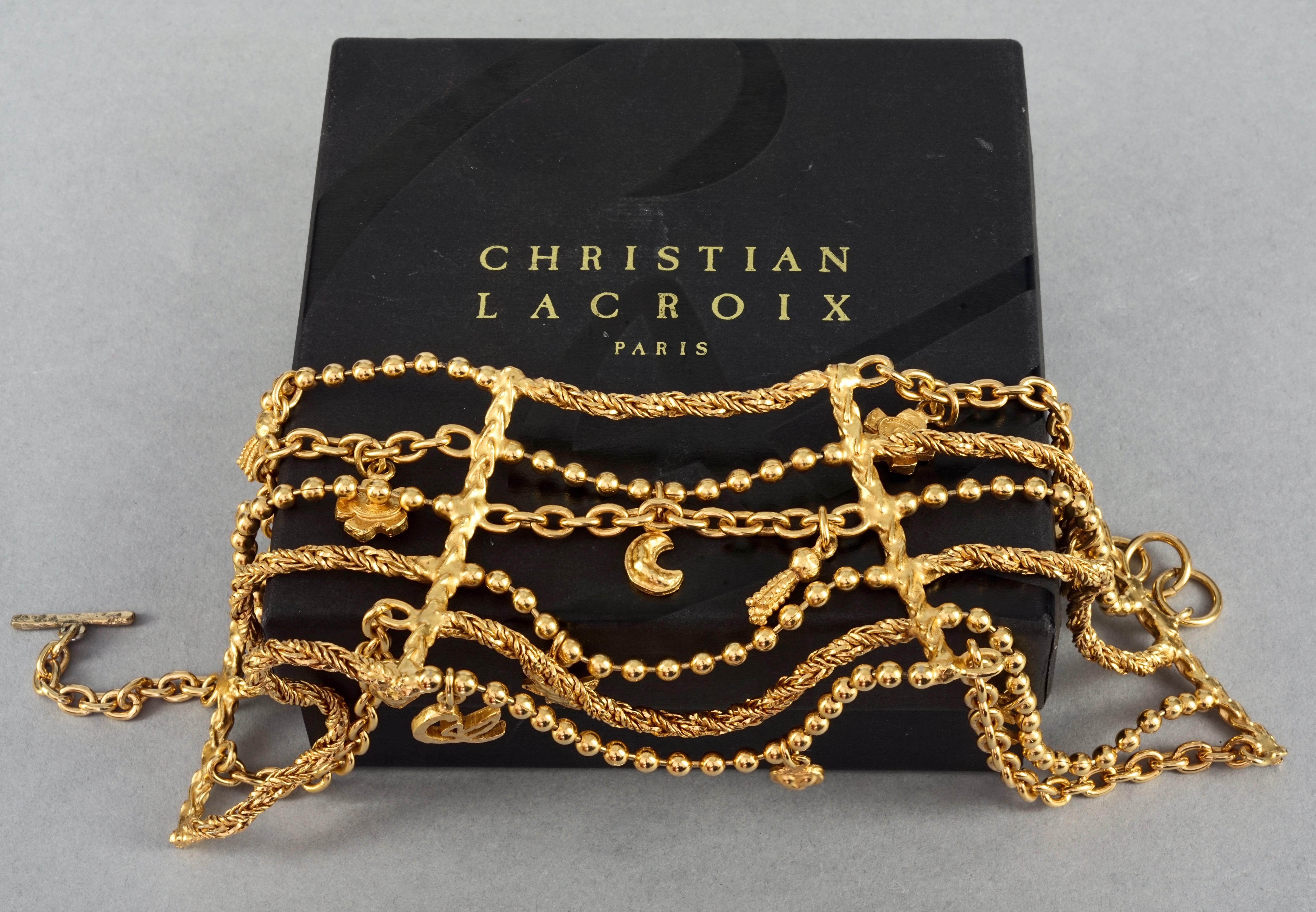 Vintage CHRISTIAN LACROIX Multi Layer Iconic Charm Choker Necklace

Measurements:
Height: 3.74 inches (9.5 cm)
Wearable Length: 13.38 inches to 14.17 inches (34cm to 36 cm)

Features:
- 100% Authentic CHRISTIAN LACROIX.
- 6 tiered alternating chains