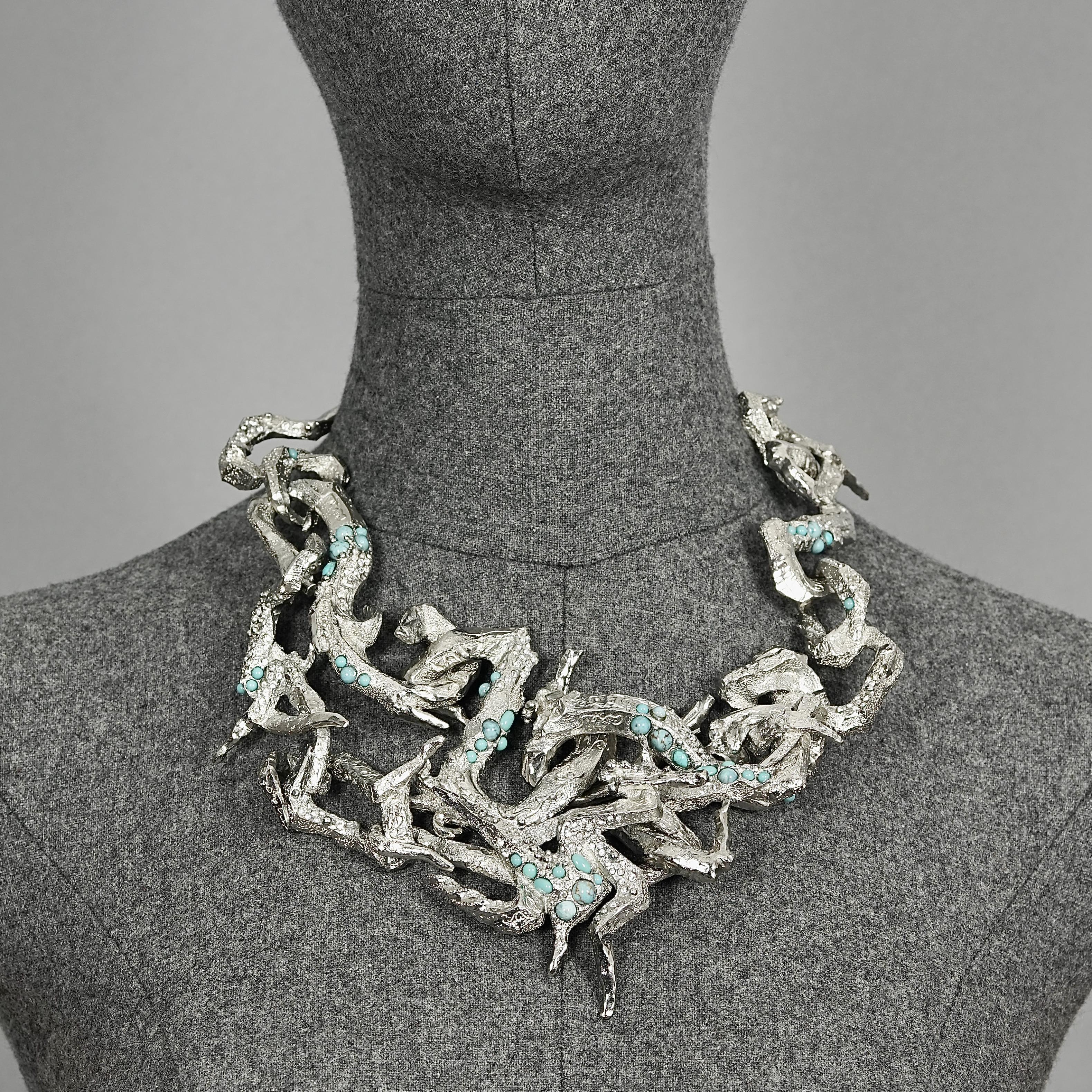 Vintage CHRISTIAN LACROIX Opulent Rigid Turquoise Stone Choker Necklace

Measurements:
Height: 4.72 inches (12 cm)
Wearable Length: 16.53 inches to 18.50 inches (42 cm to 47 cm)

Features:
- 100% Authentic CHRISTIAN LACROIX.
- Articulated textured