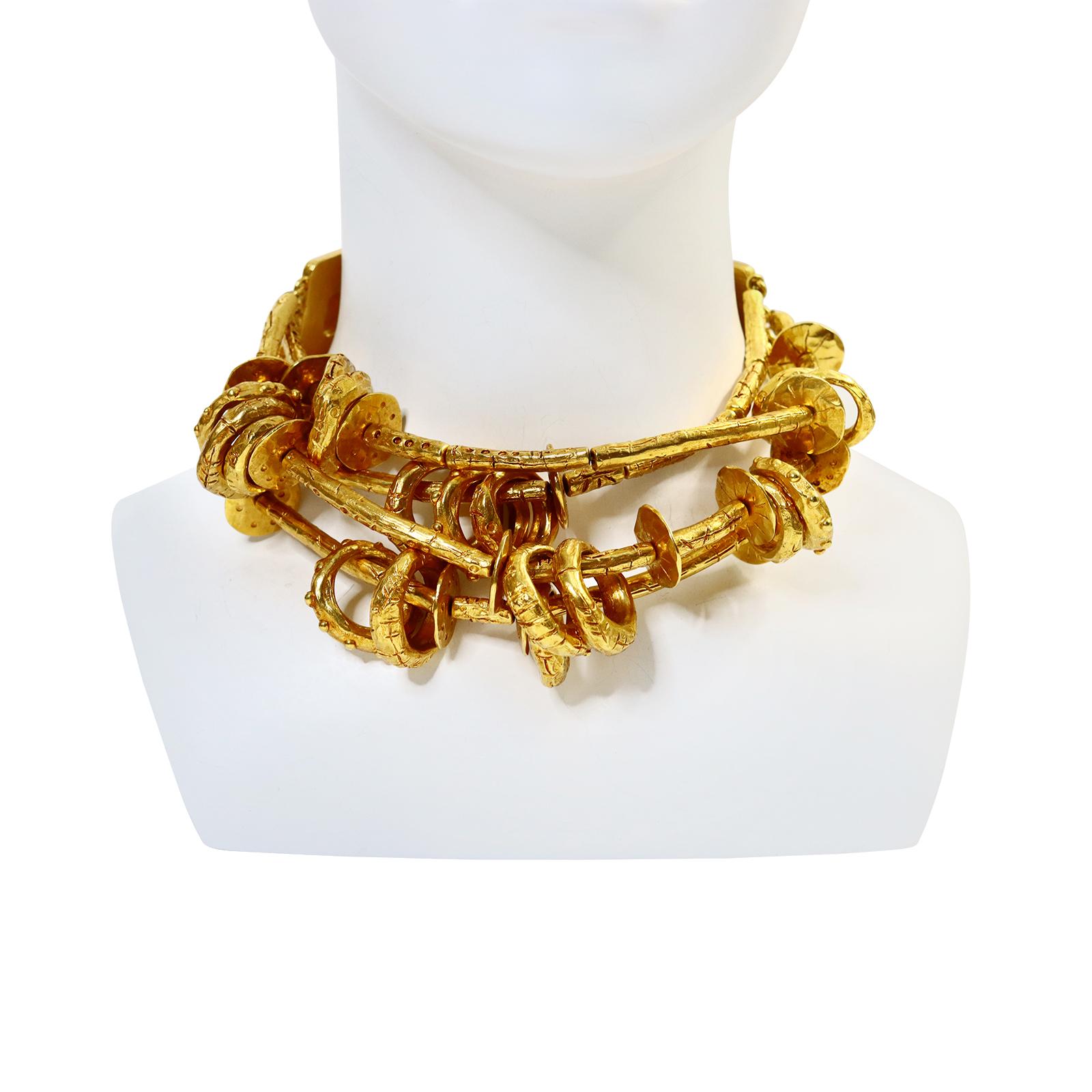 CHRISTIAN LACROIX vintage rare massive ethnic tribal inspired four strands gold toned choker necklace featuring links and rings. Both ends are made of deep red studded enamel embellished with orange resin cabochon. This is one of the special and