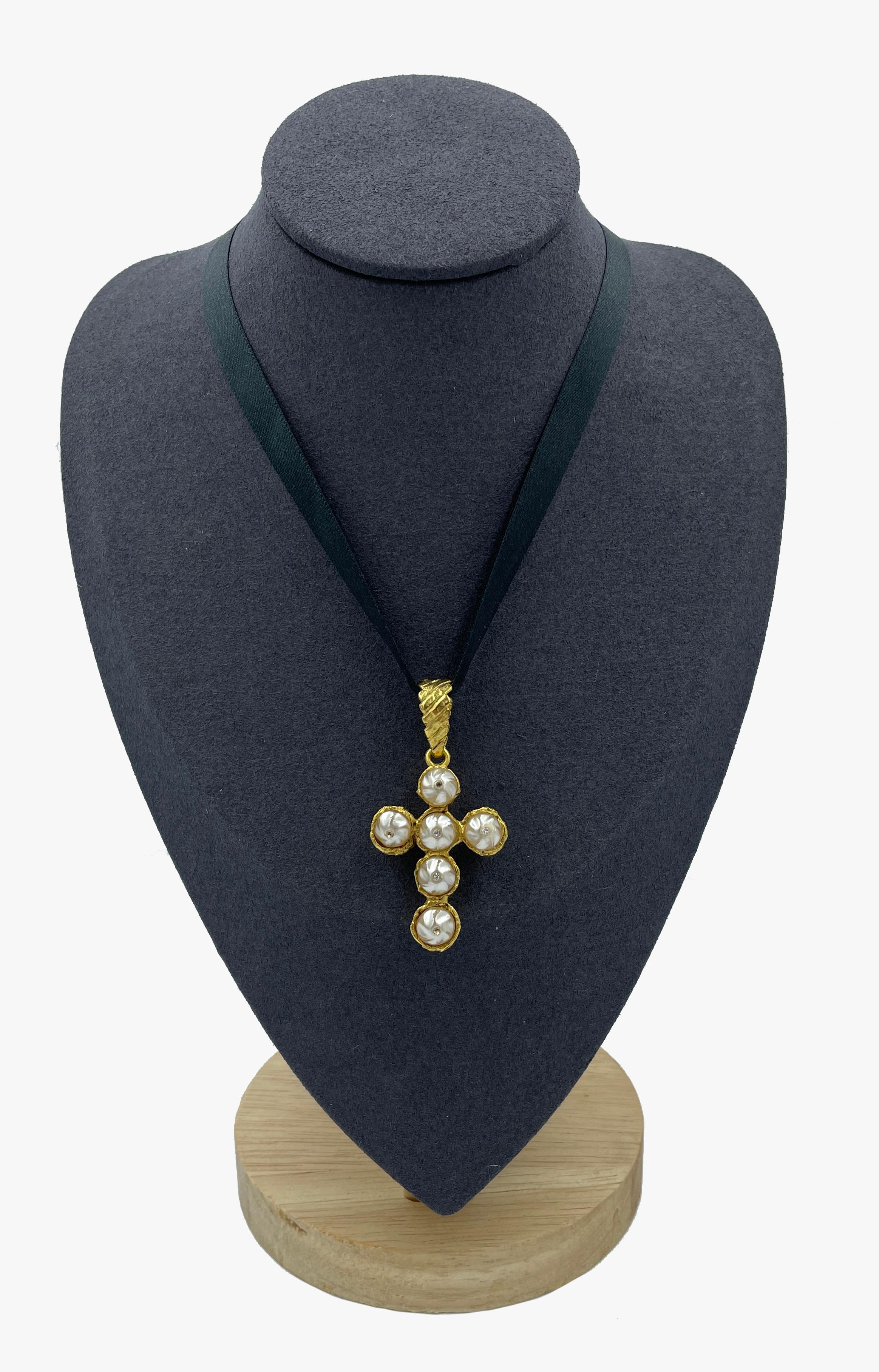 Vintage Christian Lacroix gold tone cross embellished with artificial baroque pearls and rhinestones. 
Early 1990s
Can be worn as a pendant by clipping onto choker or chain
Cross length  – 4,5 cm 
Total length – 5,3 cm 
Signed
(!) Black choker