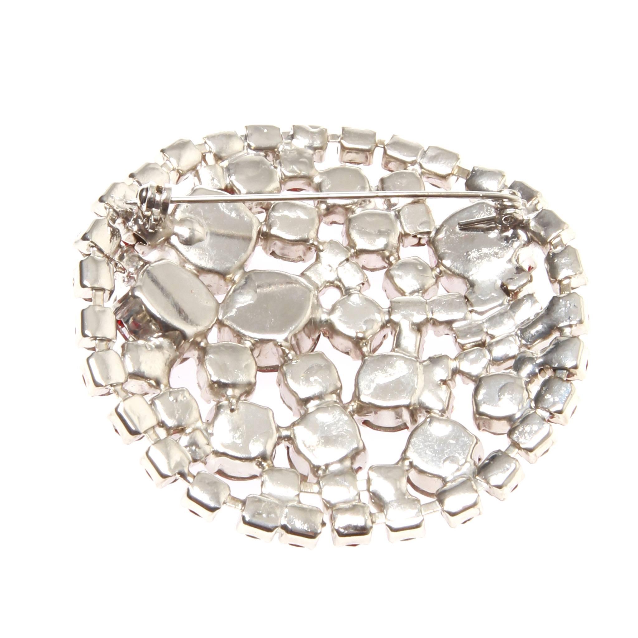 Vintage Christian Lacroix red stone domed brooch, from the collaboration with Avon for the fragrance releases'.

Red crystals are in three varying tones and sizes creating a beautiful cluster of gems. 

Roll needle closure. 


