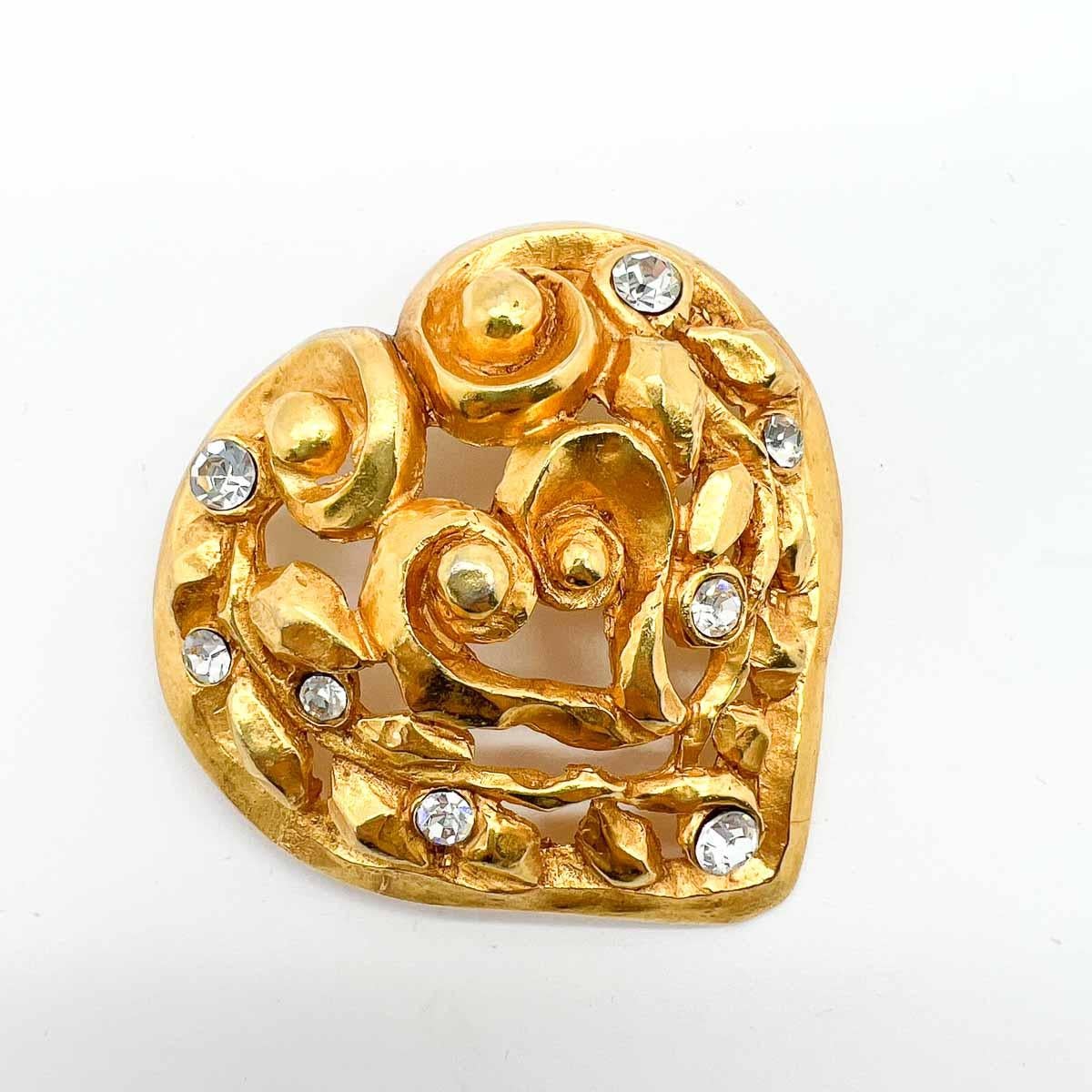 An iconic piece of fashion history, a Vintage Christian Lacroix Heart Brooch, a limited edition piece designed for Noel 1991. Statement in scale this beauty if exquisitely crafted and is a rare archive find.
Christian Lacroix established his own