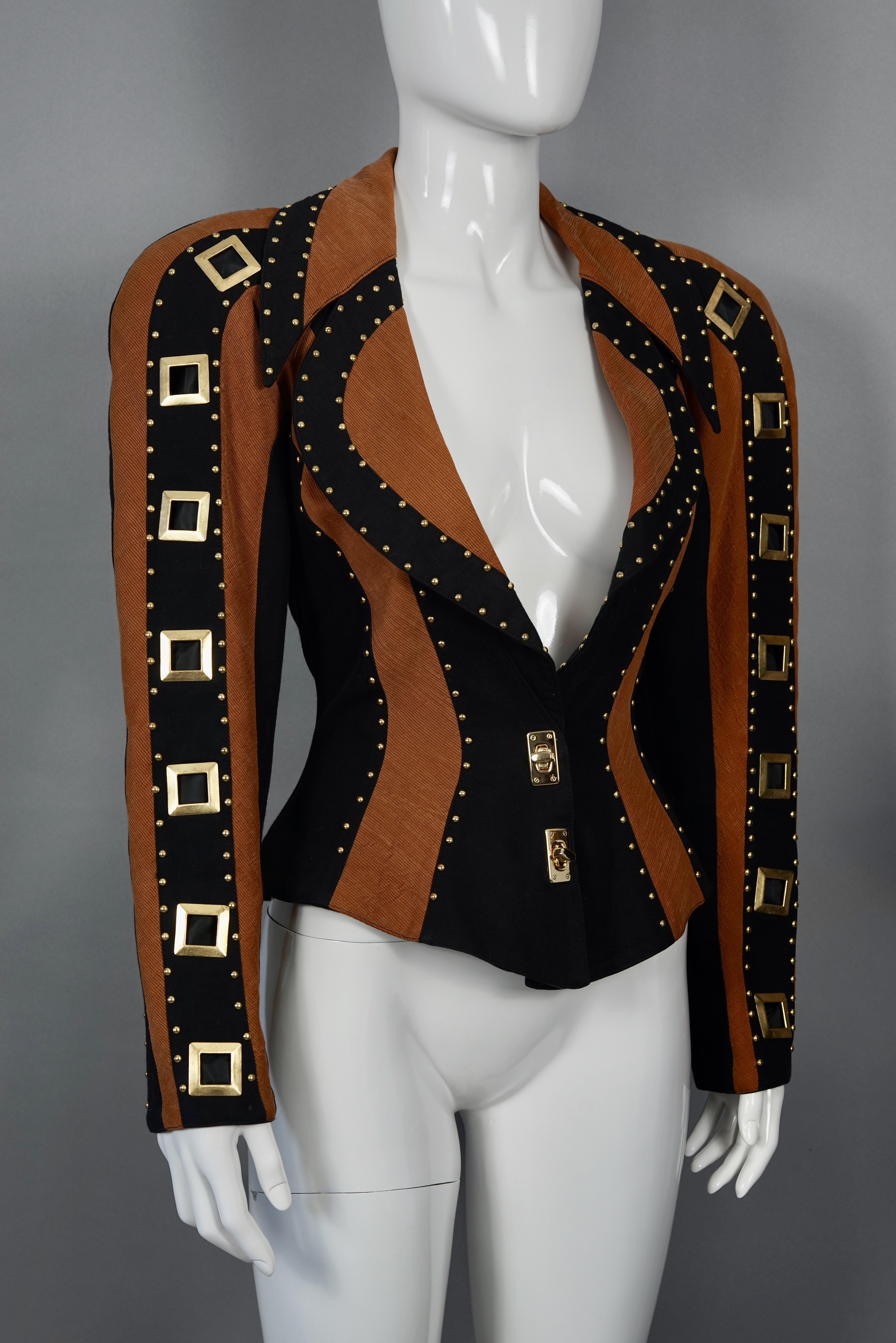 Vintage CHRISTIAN LACROIX Studs and Jeweled Buttons Contrast Jacket

Measurements taken laid flat, please double bust and waist:
Shoulder: 22.04 inches (56 cm)
Sleeves: 23.22 inches (59 cm)
Bust: 18.89 inches (48 cm)
Waist: 15.35 inches (39