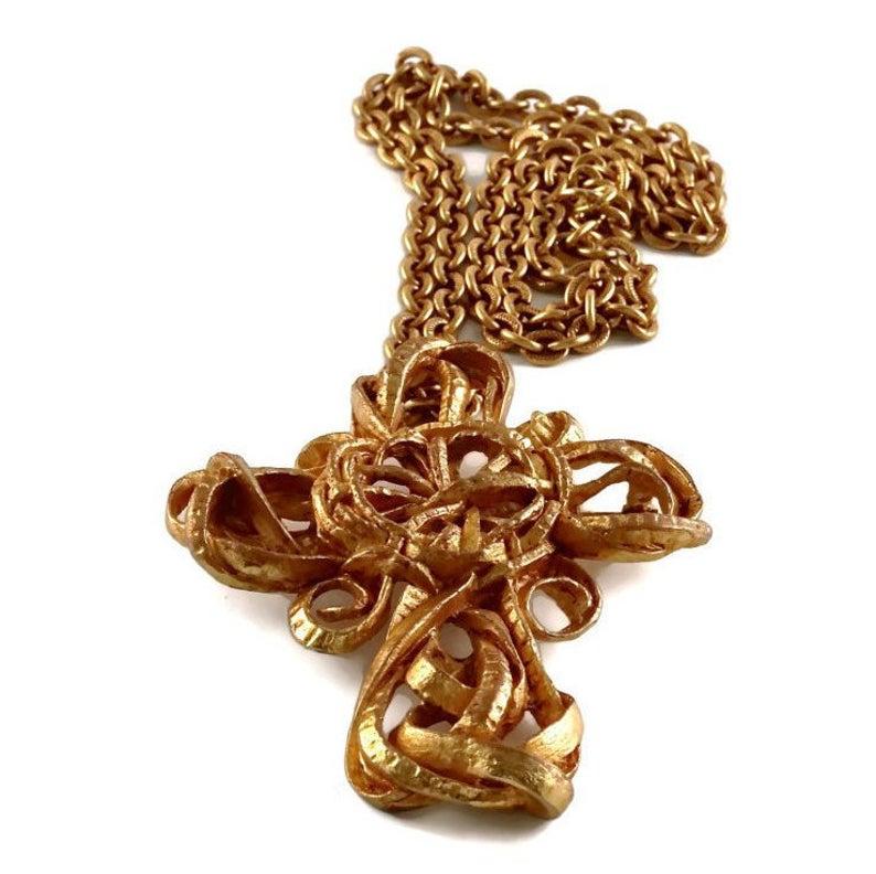 Vintage CHRISTIAN LACROIX Torsade Cross Brooch Necklace

Measurements:
Height : 3 4/8 inches (8.89 cm)
Width: 2 7/8 inches (7.30 cm)

Features:
- 100% Authentic CHRISTIAN LACROIX.
- Chunky cross brooch/ pendant necklace in torsade pattern.
- Could