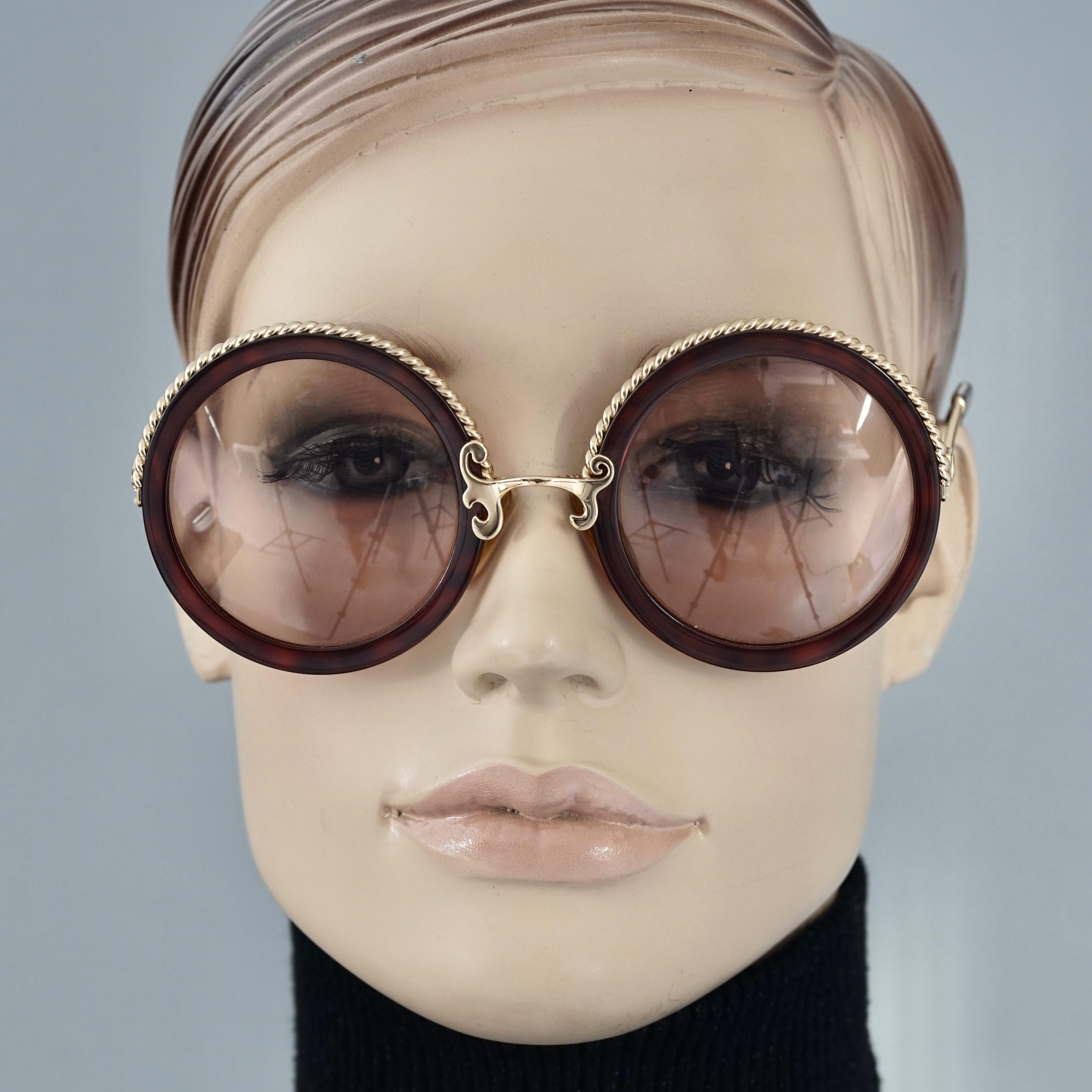 Vintage CHRISTIAN LACROIX Tortoiseshell Round Sunglasses

Measurements:
Height: 2.36 inches (6 cm)
Horizontal Width: 5.39 inches (13.7 cm)
Arms: 4.92 inches (12.5 cm)

Features:
- 100% Authentic Vintage CHRISTIAN LACROIX. 
- Round faux tortoiseshell