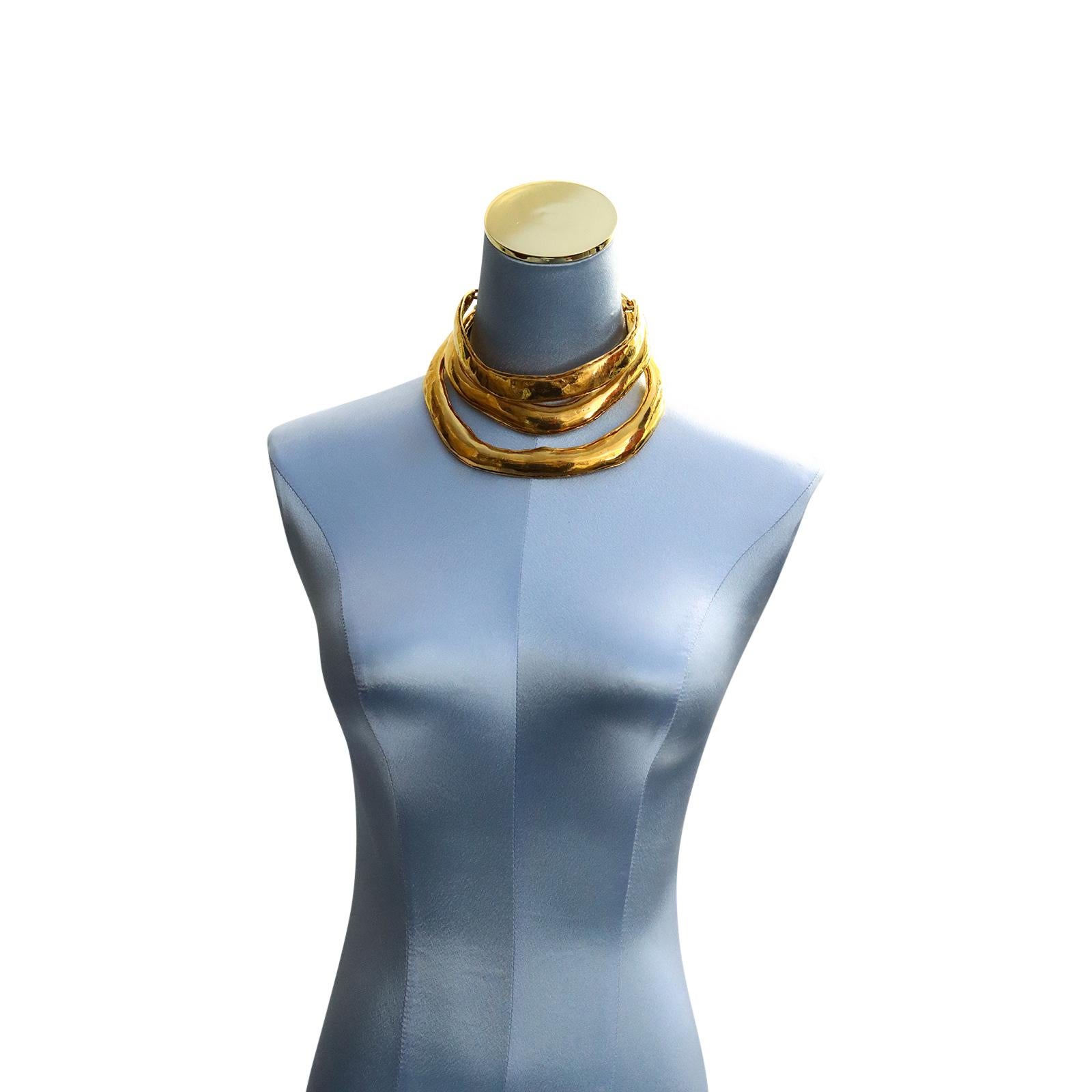 Vintage CHRISTIAN LACROIX Triple Layer Gold Tone Choker Masai Necklace. Triple Ring  Rigid Necklace Choker. This is ICONIC Lacroix.

This will elevate your look and be in style until the end of time.

Measurements:
Inner Circumference: 12.40 inches