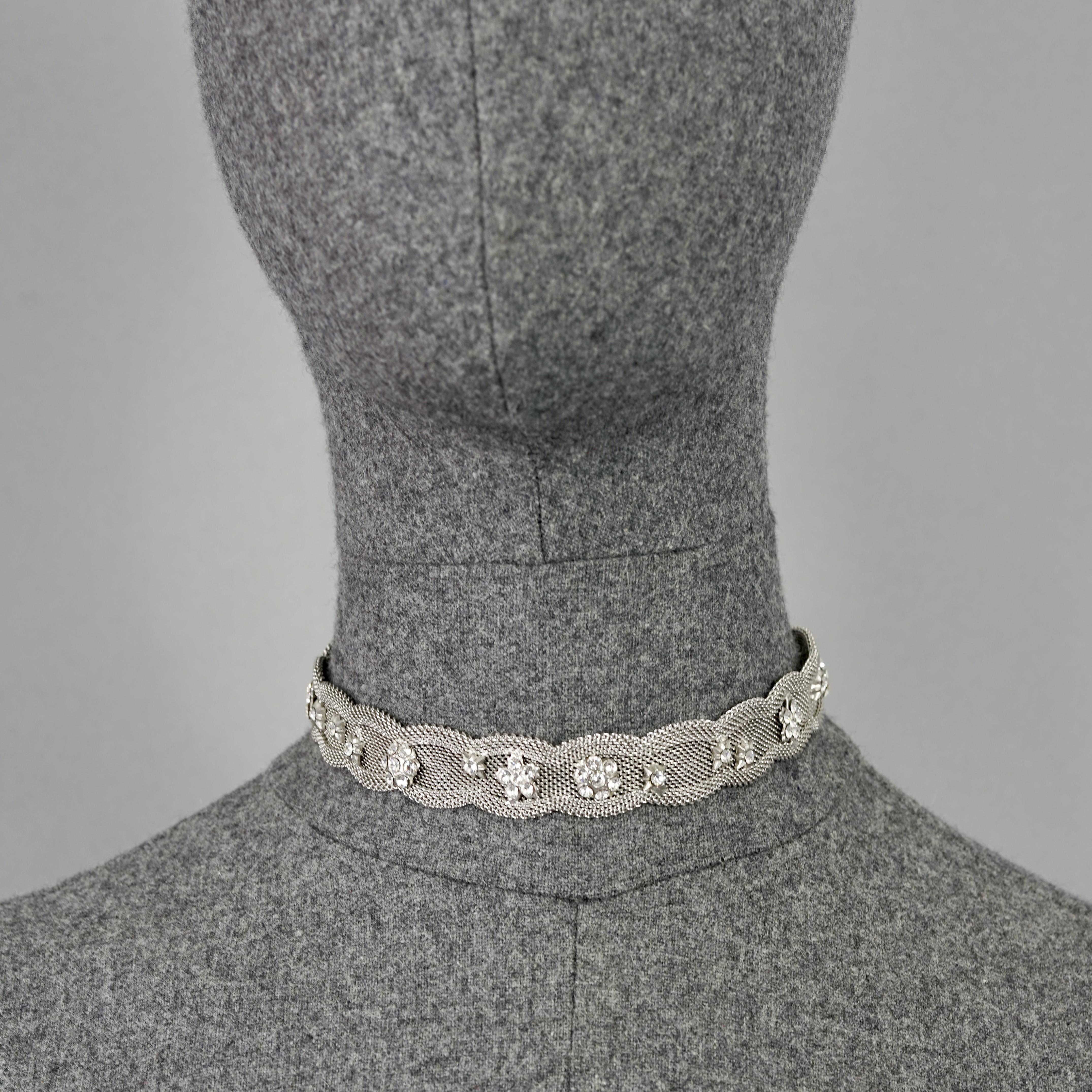 Vintage CHRISTIAN LACROIX Victorian Mesh Flower Rhinestone Silver Choker Necklace

Measurements:
Height: 0.75 inches (1.9 cm)
Wearable Length: 13.19 inches (33.5 cm)

Features:
- 100% Authentic CHRISTIAN LACROIX.
- Delicate mesh choker embellished
