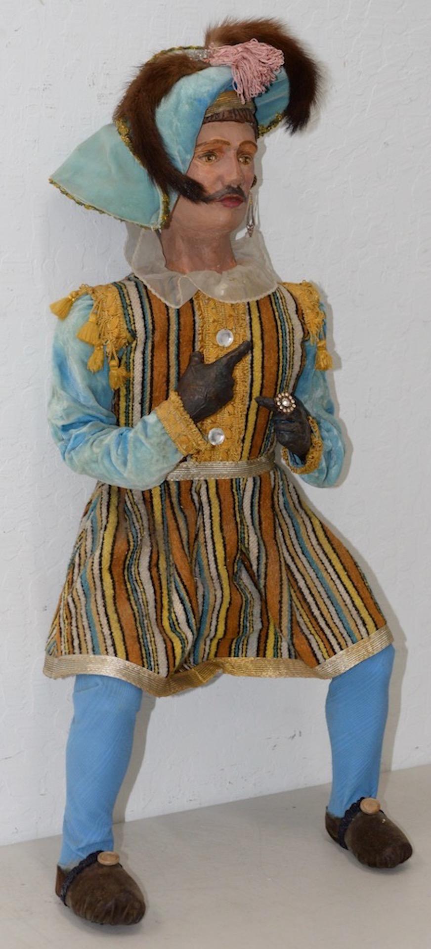 Vintage Christmas Holiday Musketeer Doll, circa 1940s-1950s

Hand painted. Handmade clothing. Very nice vintage doll. Unsure if it's wood or papier mâché.

Dimensions: 13
