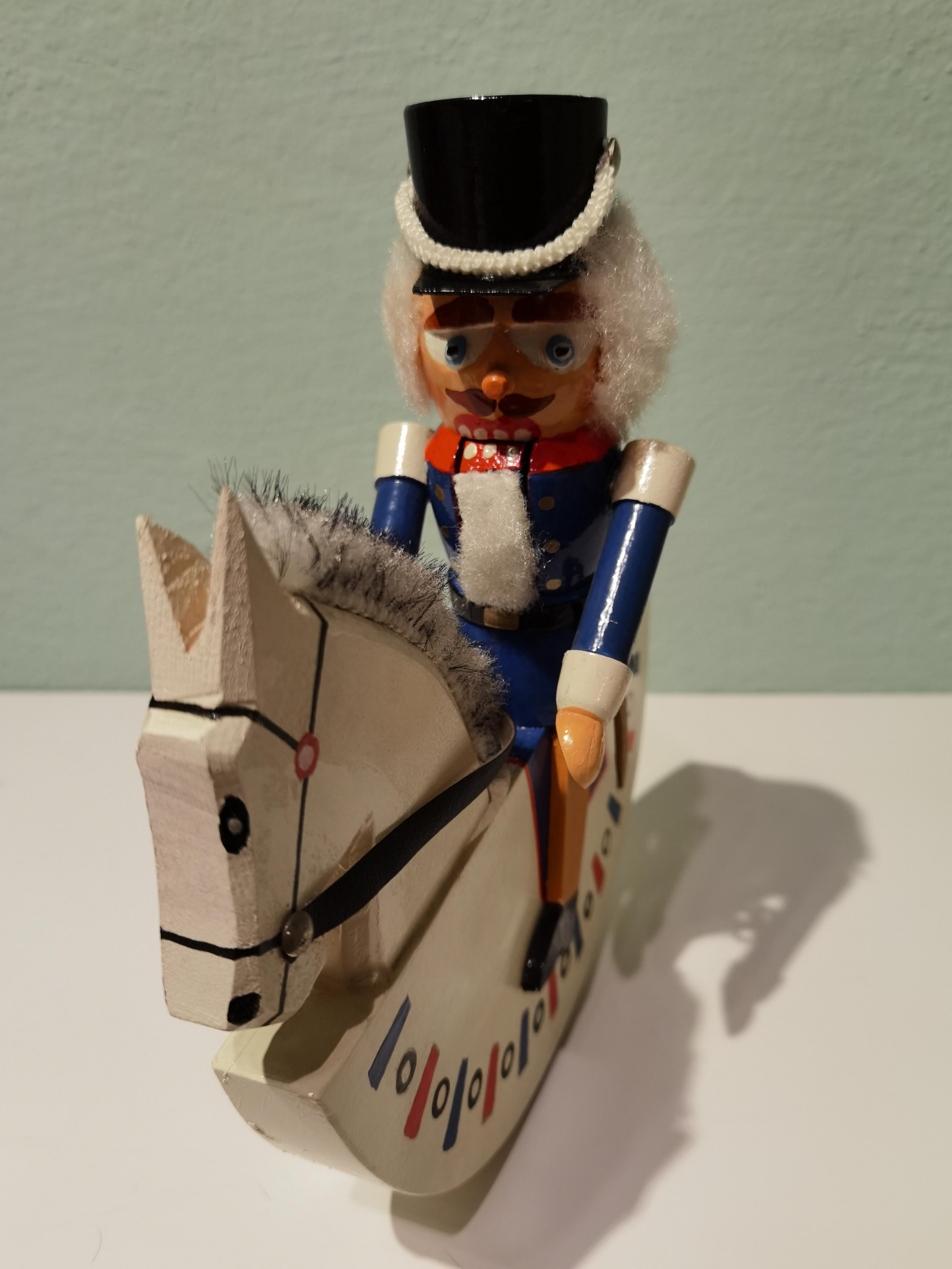 Rare wooden nutcracker figure from the Erzgebirge. The region Erzgebirge formerly Eastern Germany is famous for this special kind of nutcrackers where intricate carving has been their home. Completely handmade in wood and hand-painted in bright red