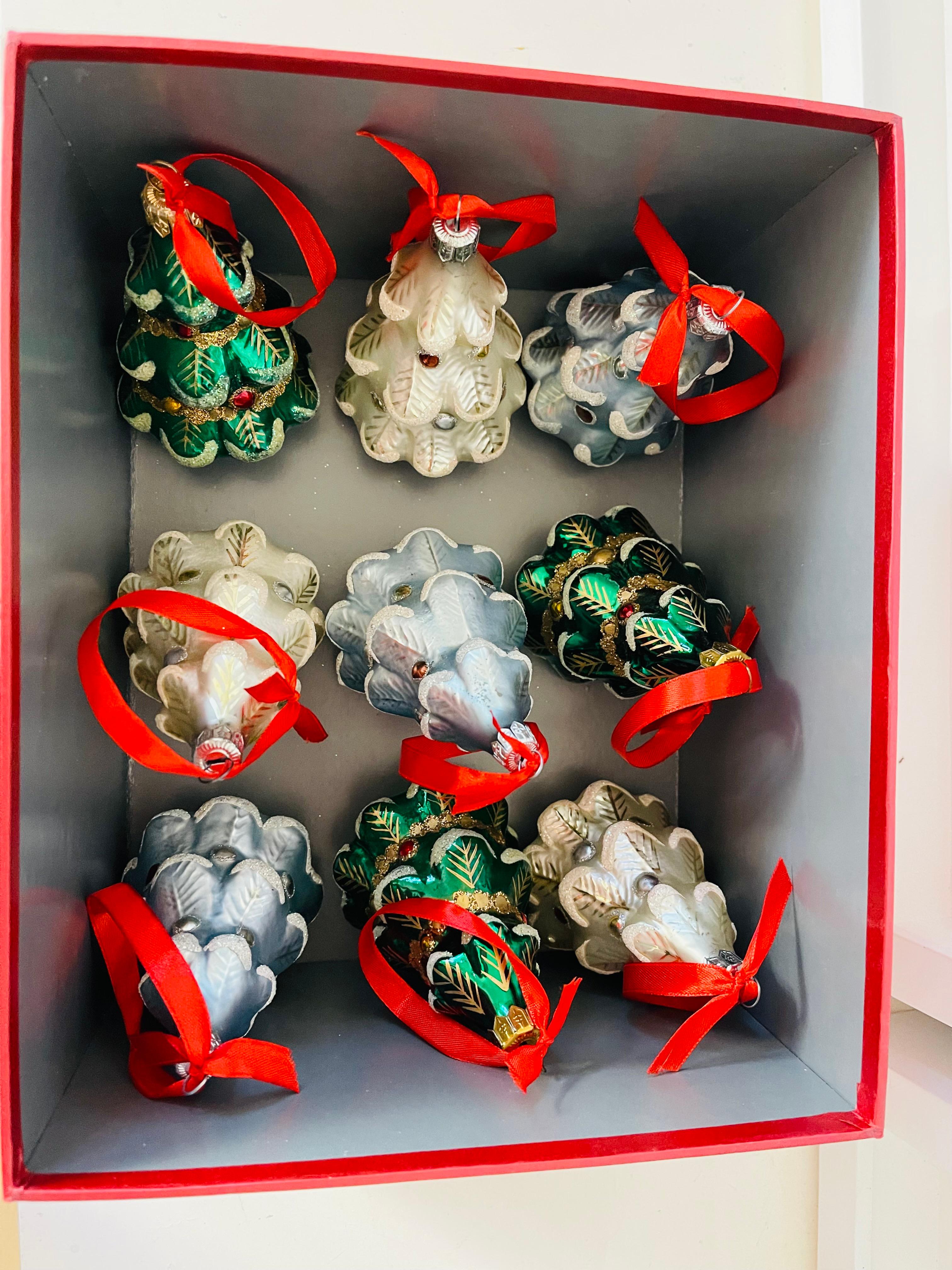 Vintage set of 9 pcs Vintage Christmas Ornaments Christmas Trees in 3 different colors , 5” each, with silk ribbons and in a cardboard gift box. Blown glass in an old European tradition, silvered inside and Handpainted outside. Beautiful ornaments