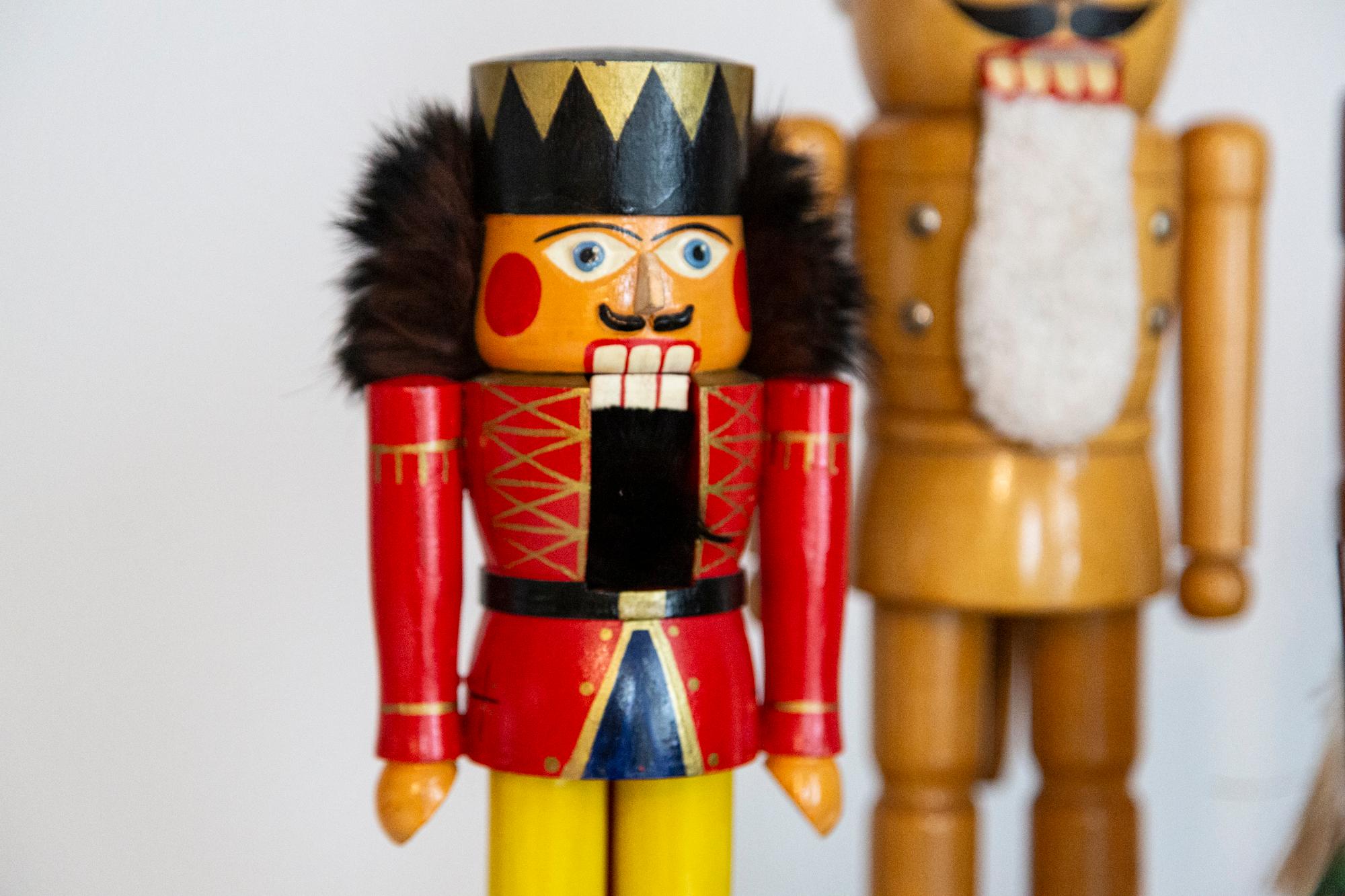 Wooden nutcracker figure from the Erzgebirge. The region Erzgebirge formerly Eastern Germany is famous for this special kind of nutcrackers, where intricate carving has been their home. Completely hand-painted in bright colors and decorated with
