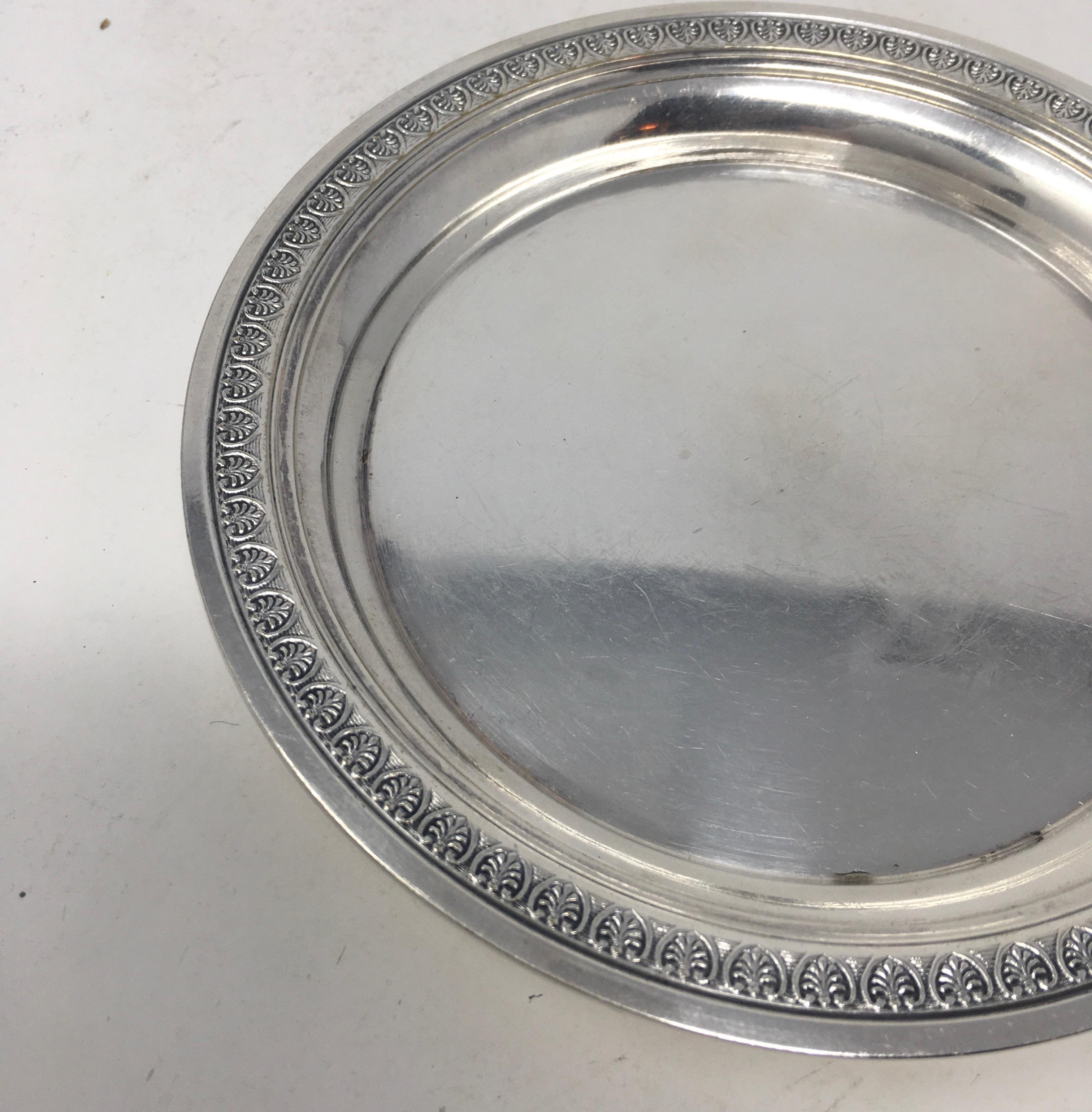 Found in France, this vintage Christofle hotel silver serving platter with beautifully detailed edge, is stamped Christofle on the bottom and has a great aged patina. It would be wonderful in a cabinet and a great addition to your table or buffet.