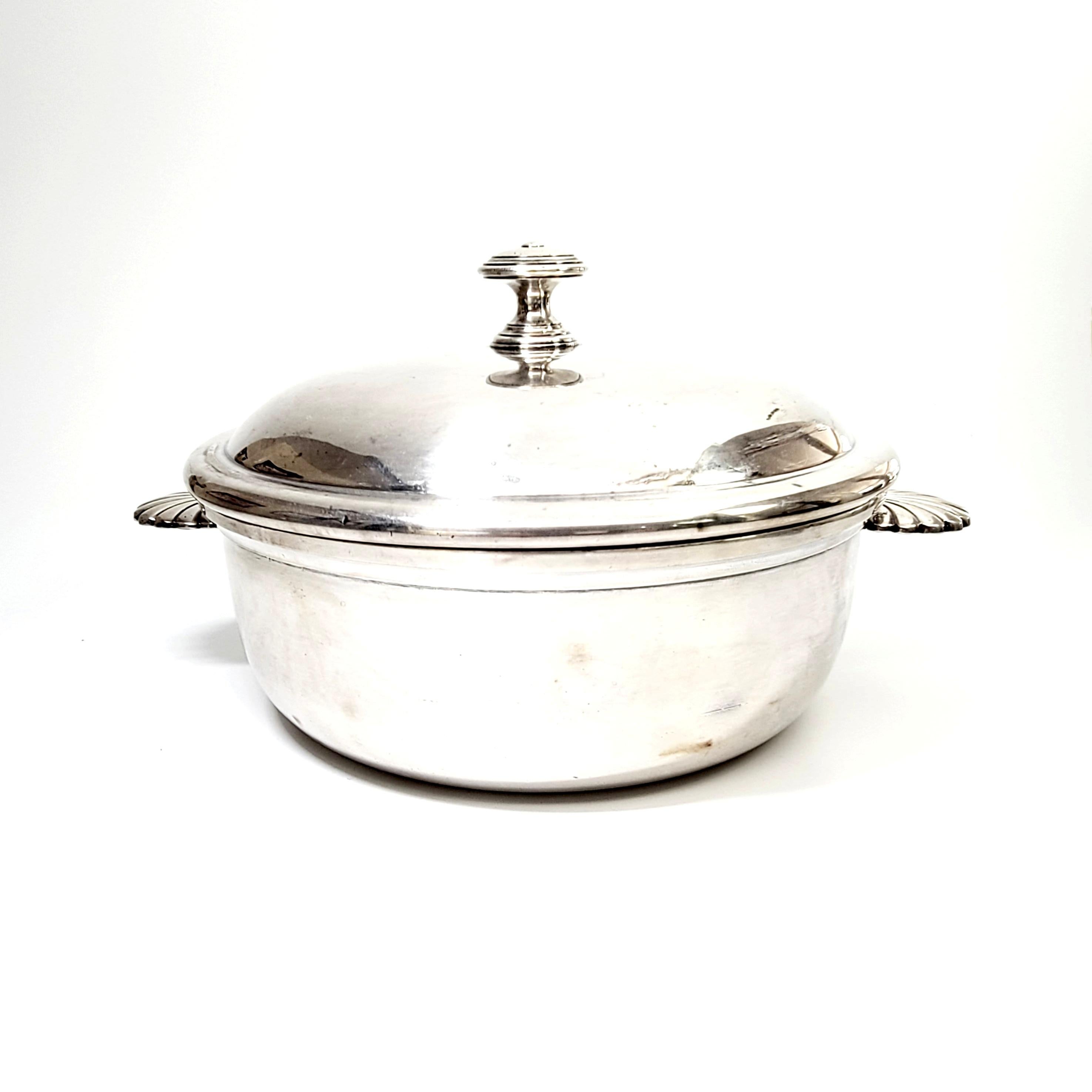 Vintage French silver plate covered vegetable dish by Christofle.

Well known and highly regarded tableware company Christofle is known for beautiful design and high quality craftsmanship. This vegetable bowl features shell motif handles and a lid