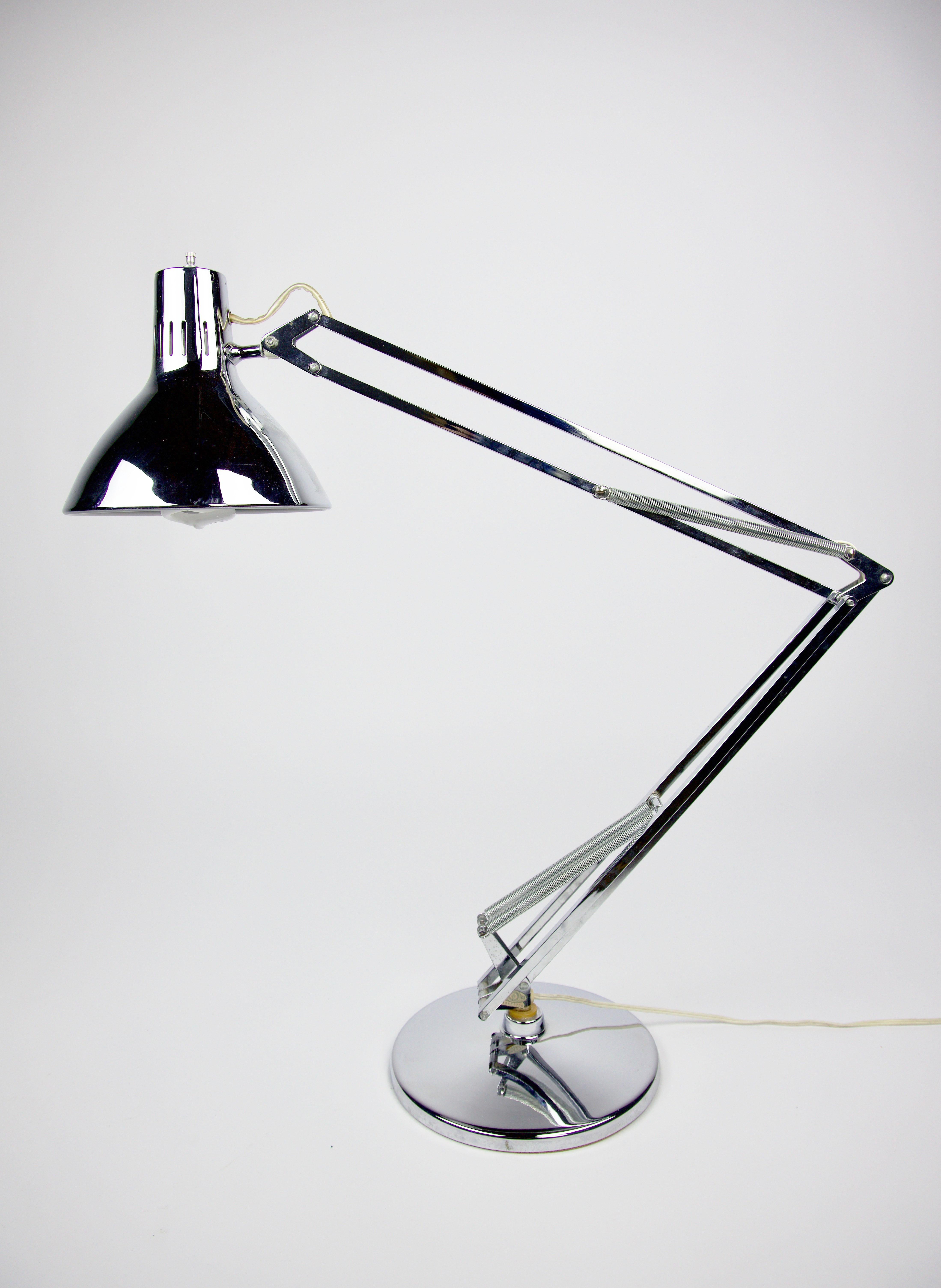 Vintage chrome 3 hinged articulating industrial task light with chrome base. Looks like a 