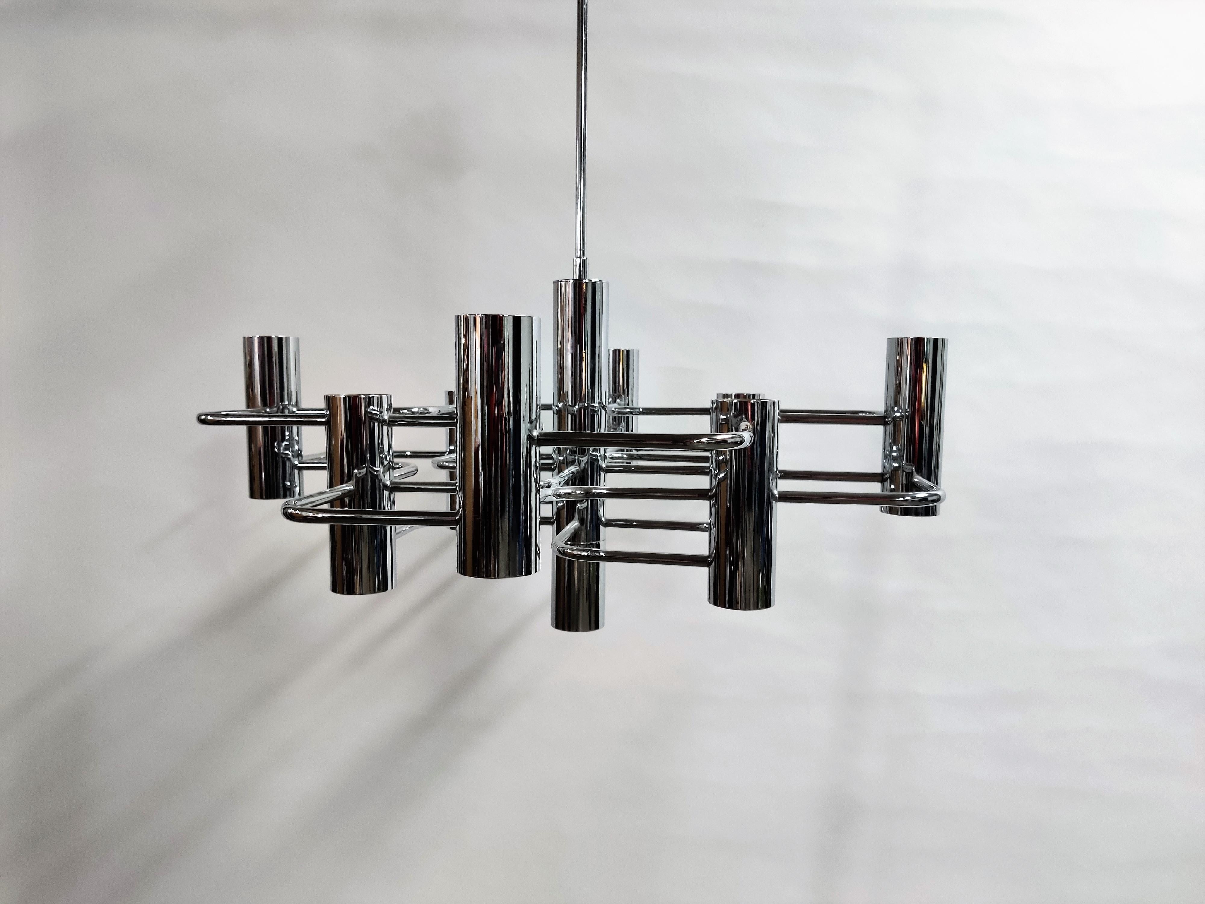 Architectural chrome candle chandelier with 9 lightpoint designed by Gaetano Sciolari for Boulanger.

Beautiful polished chrome.

Tested and ready for use with regular E14 light bulbs.

Works all-over the world.

1970s,
