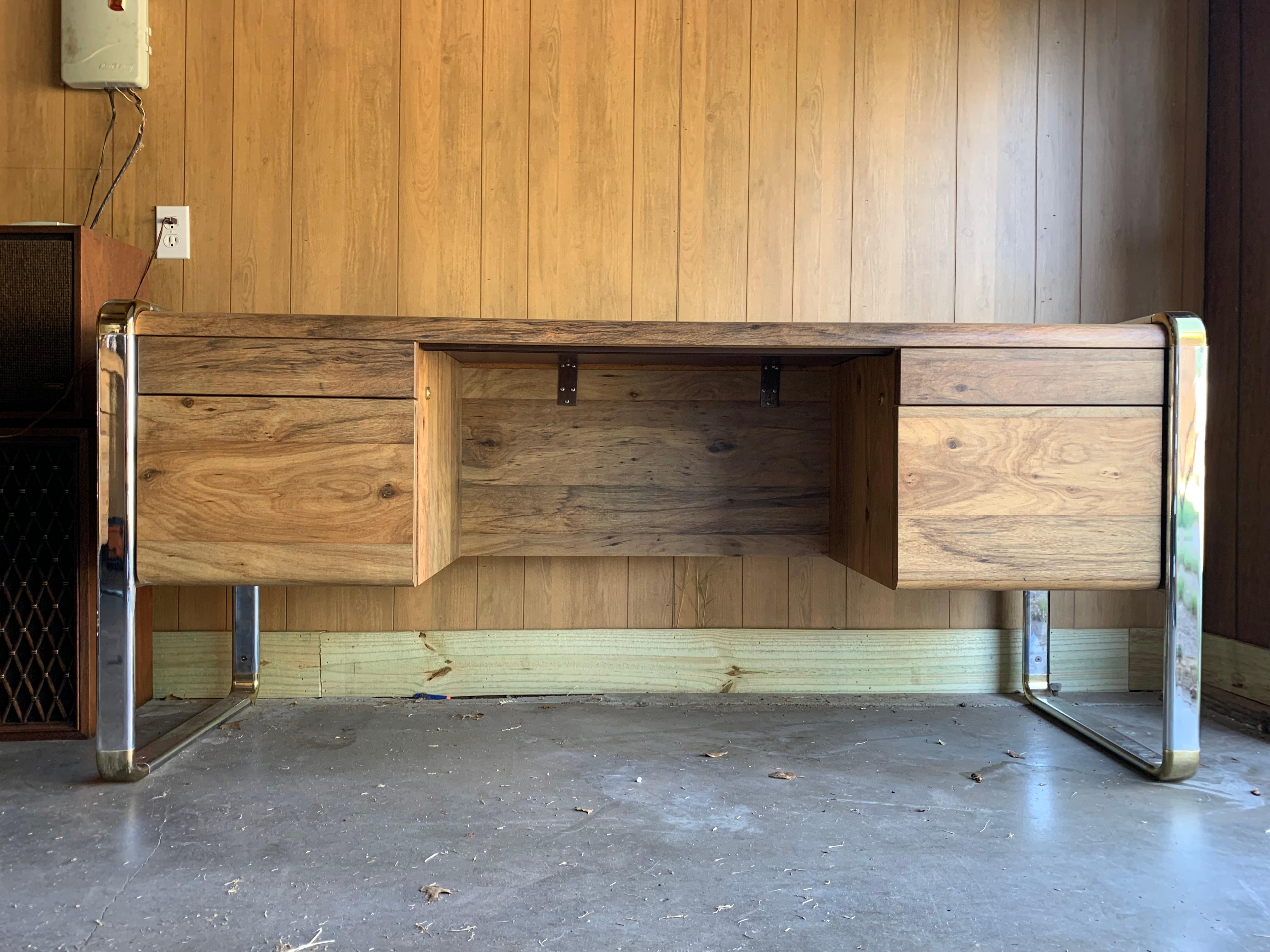 Vintage chrome and brass credenza in the style of Peter Protzmann for Herman Miller. Laminate throughout with squared off ends for legs that give it a great floating feature.