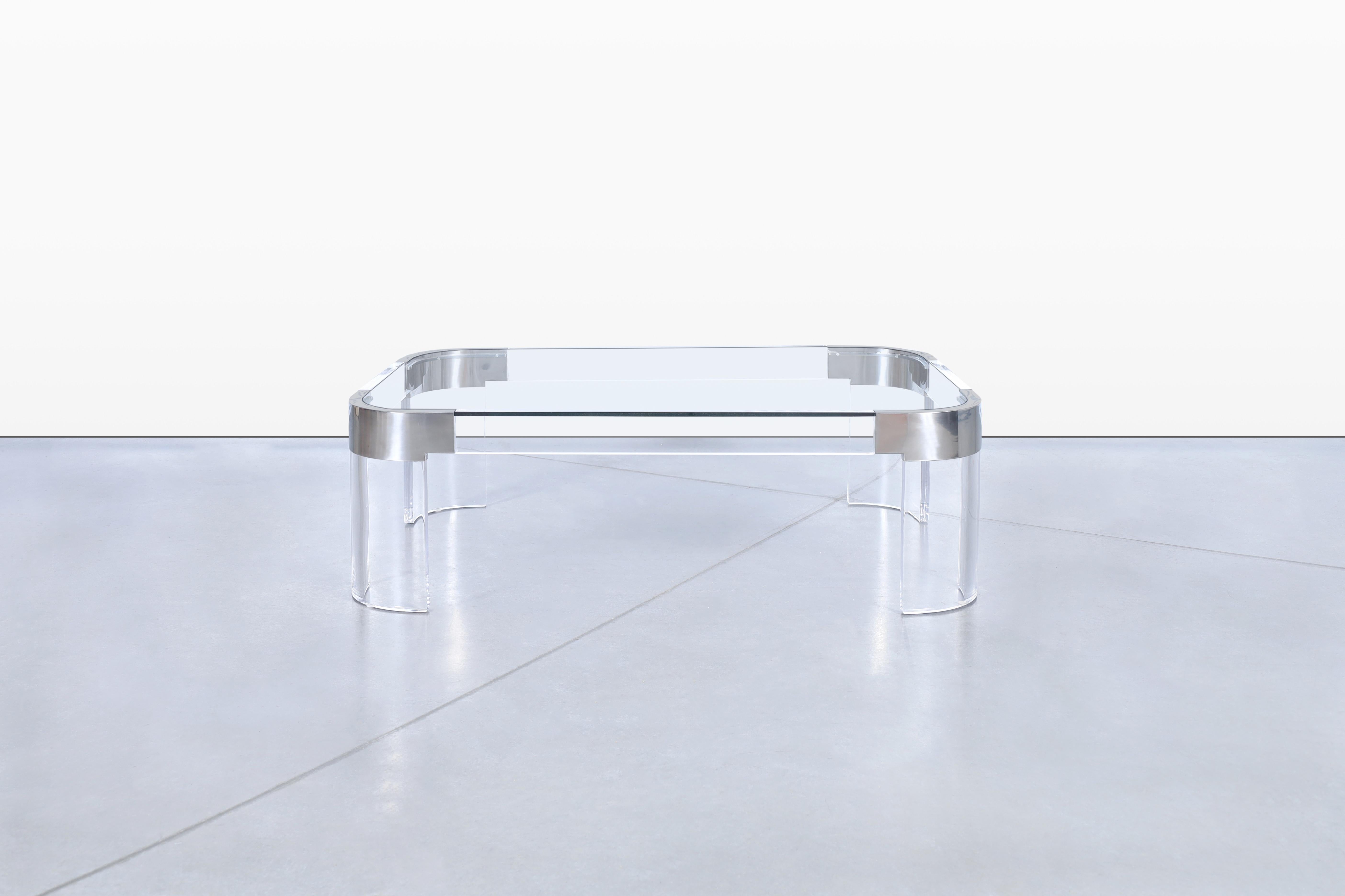 Vintage chrome and lucite coffee table designed by Charles Hollis Jones and manufactured in the United States, circa 1970s. Introducing a coffee table like no other—one that showcases elegance and refinement. This table is part of the 