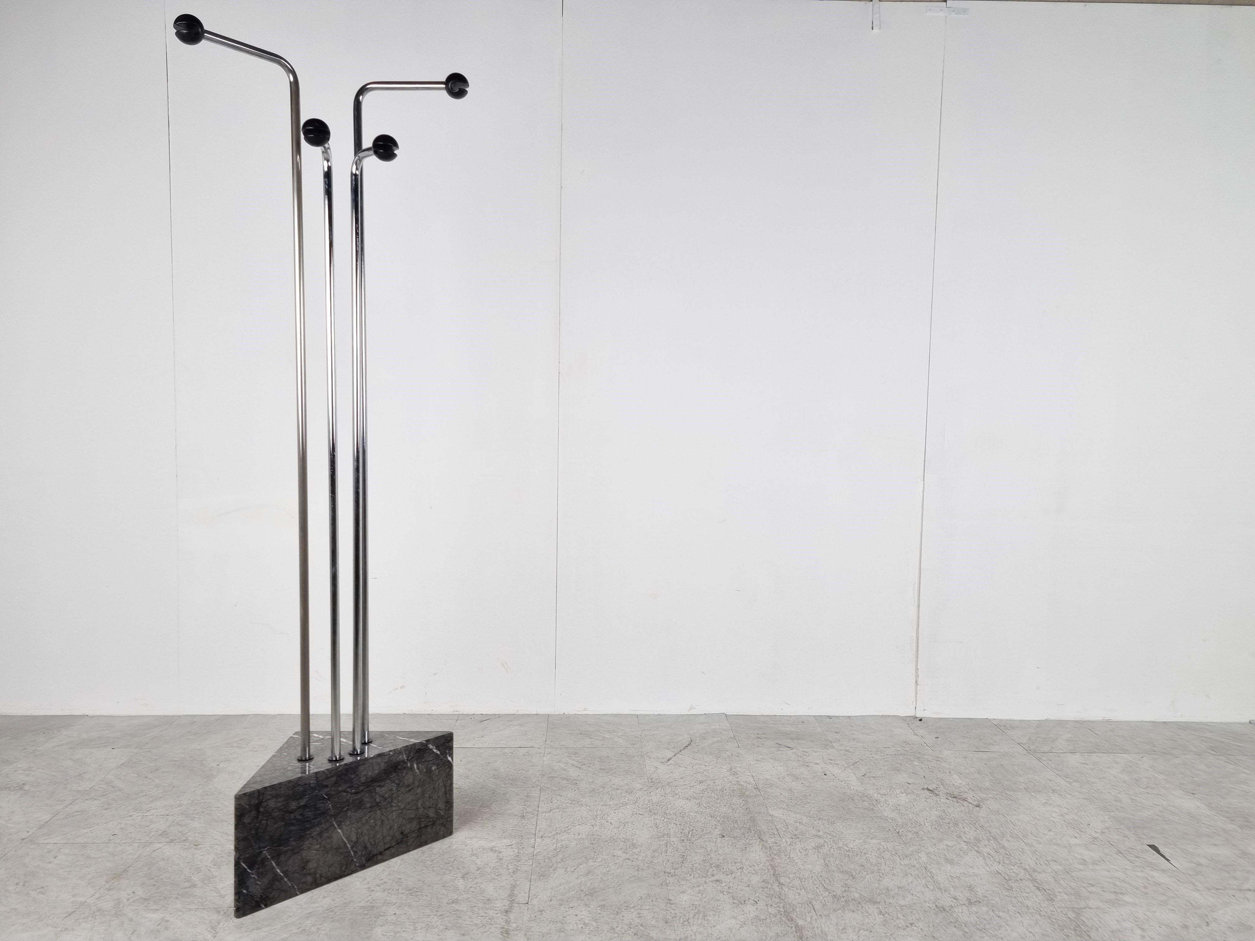 Mid-century chromed space age coat stand.

The coat stand has a solid grey marble triangular base.

4 Practically shaped hooks.

Chrome is in good condition.

The triangular base has had a previous repair to the corner of the base, not