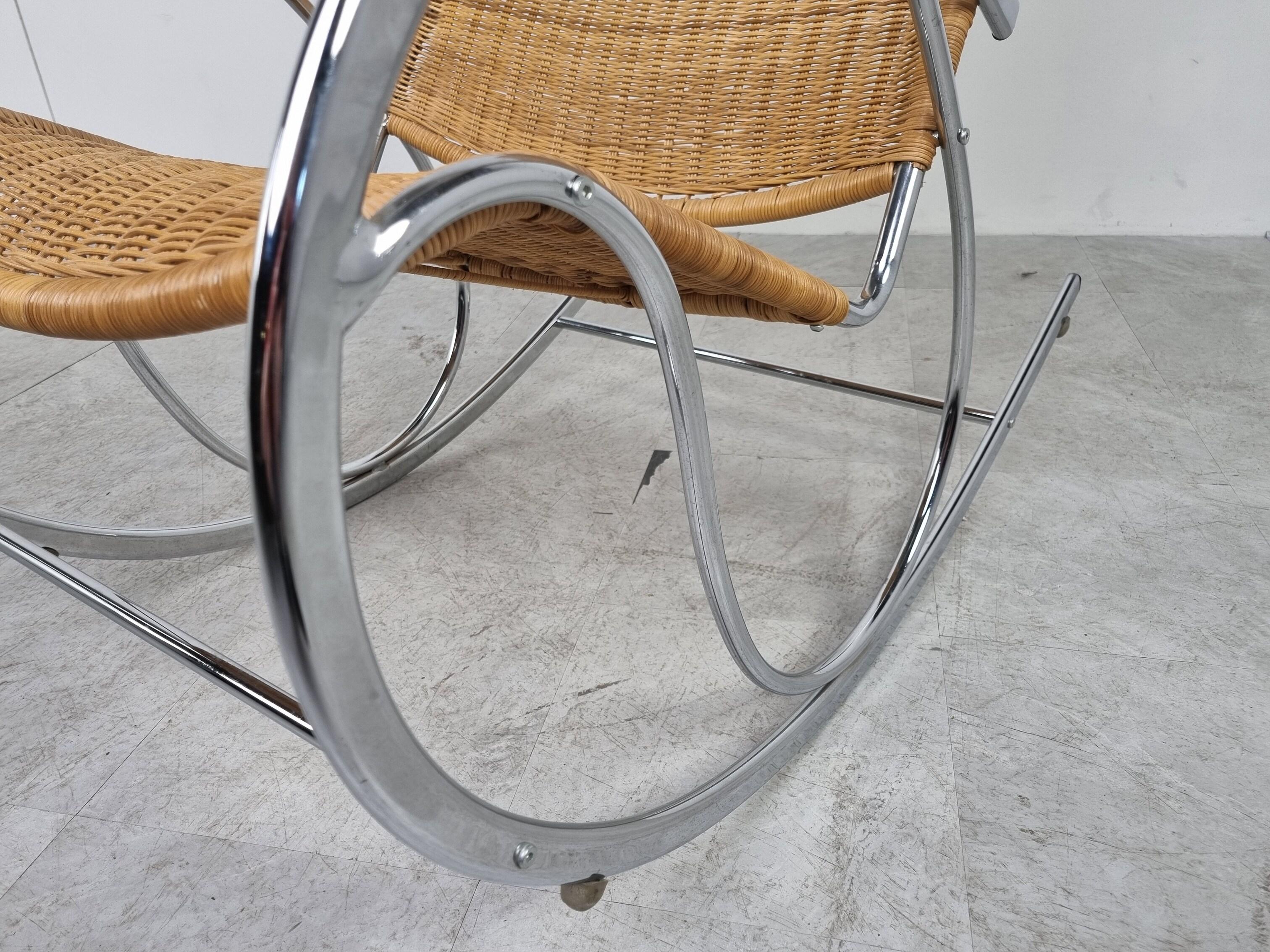 Vintage bauhaus inspired rocking chair made from wicker and chrome.

Beautiful elegant design with beech wooden armrests.

Good condition, some wear on the armrests.

Very sturdy.

1970s - Italy

Measures: Height: 103cm/40.55