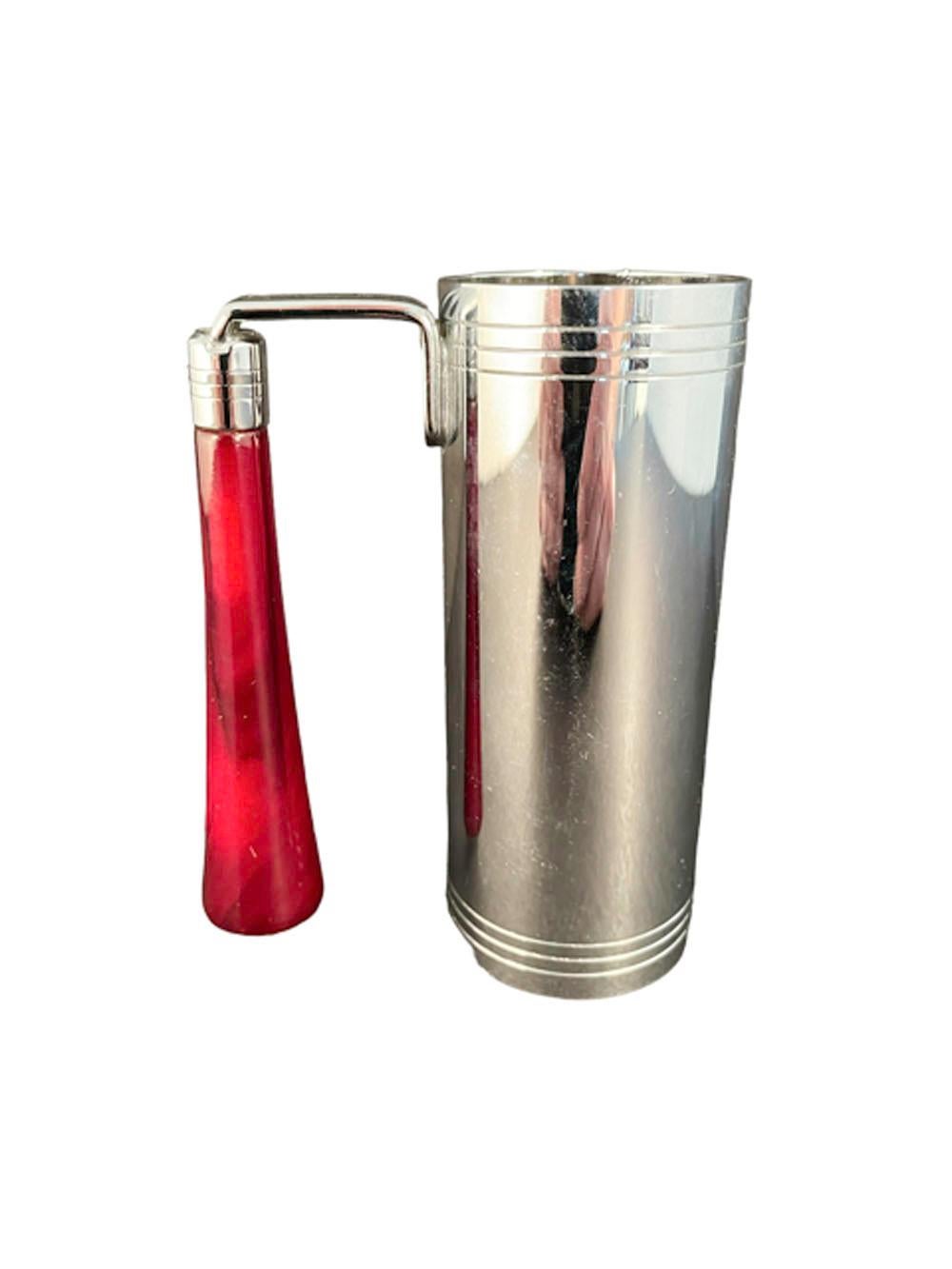 Vintage chrome jigger of cylindrical form designed as a traffic light with green, yellow and red 'lights' marked 'Safe', 'Caution' & 'Danger', attached to the rim is a vertical handle made of faux red tortoiseshell Bakelite.