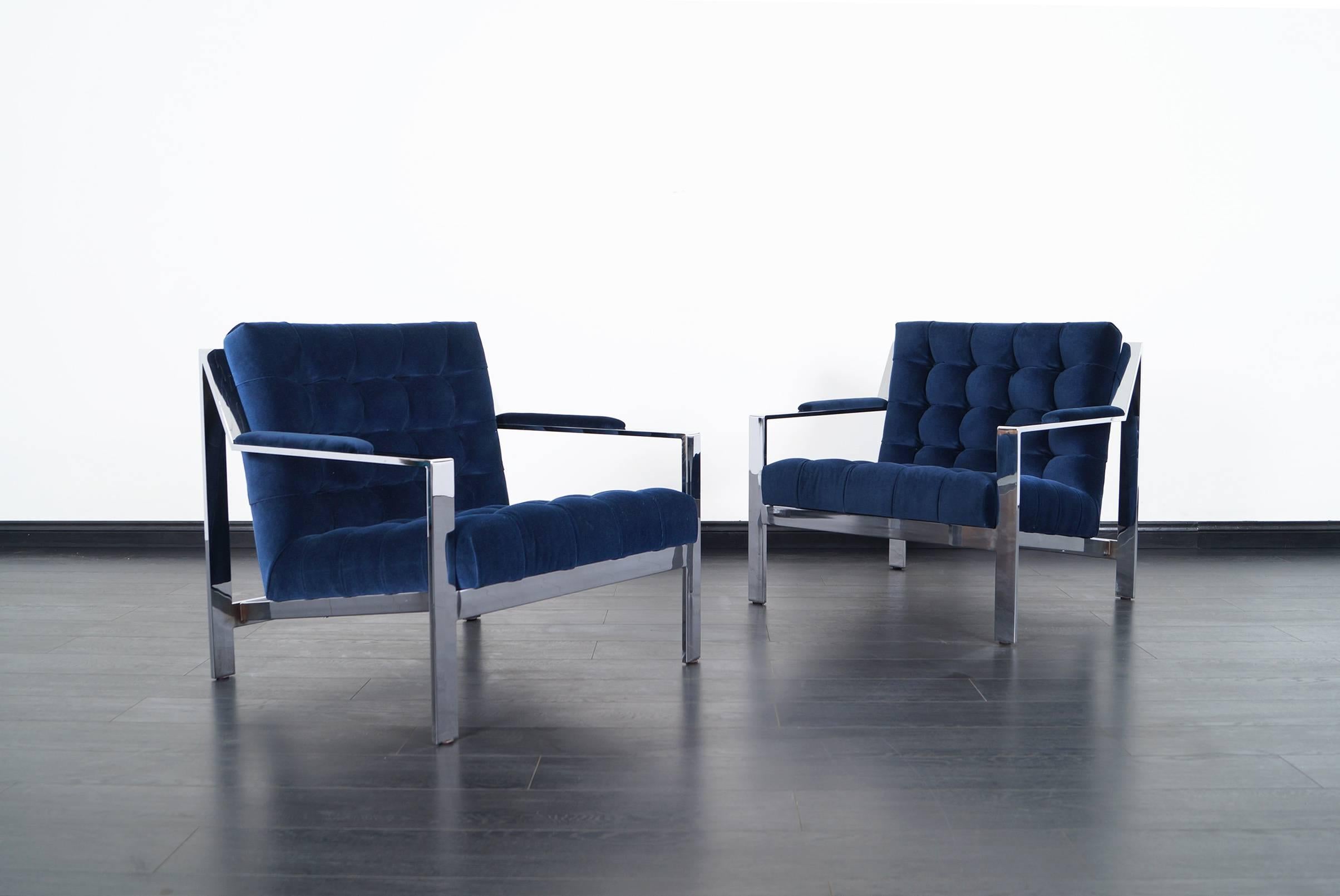 Amazing pair of chrome lounge chairs by Cy Mann. Newly reupholstered in custom biscuit upholstery in velvet.