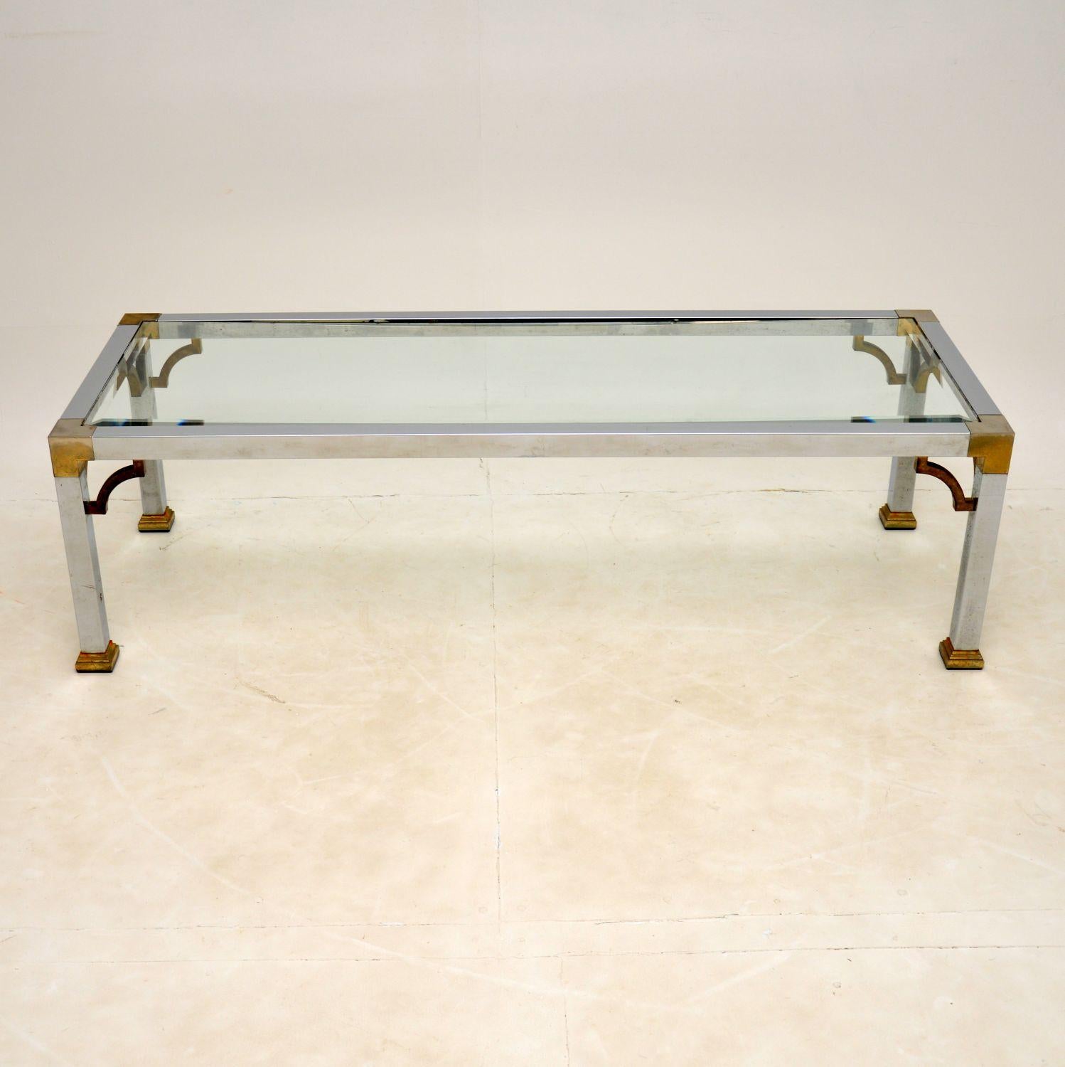A stunning vintage coffee table in chrome and brass plated aluminium. This was made in England, it dates from the 1960-70’s.

Beautifully styled and of great proportions, this is also very well made. The brass plated corners have worn and faded in