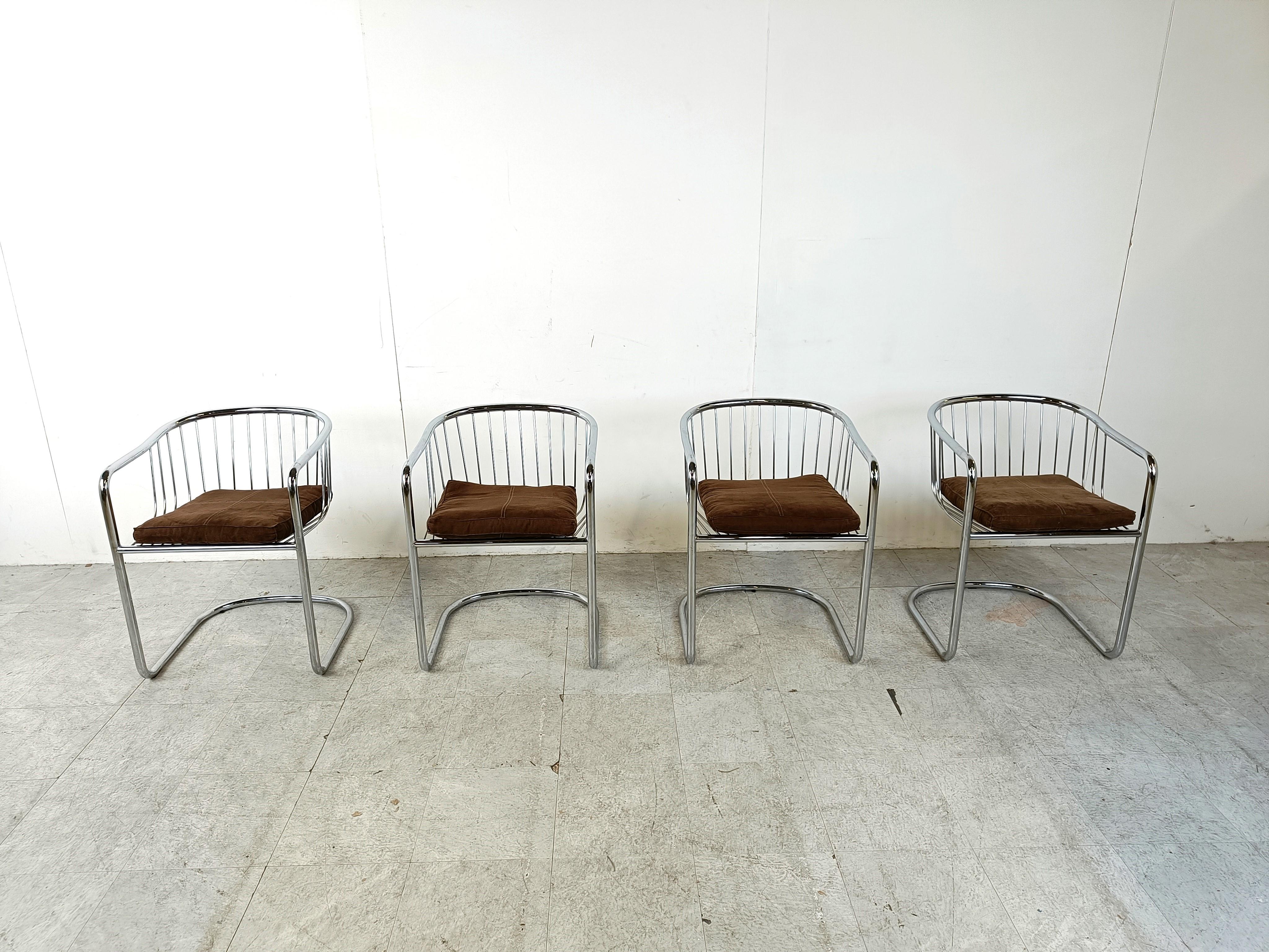 Seventies chromed tubular and chrome wire metal dining chairs with a cantilever base.

These German made dining chairs are often attributed to Gastone Rinaldi.

The cantilever design and the use of tubular chrome dates back to the 1920s - Bauhaus