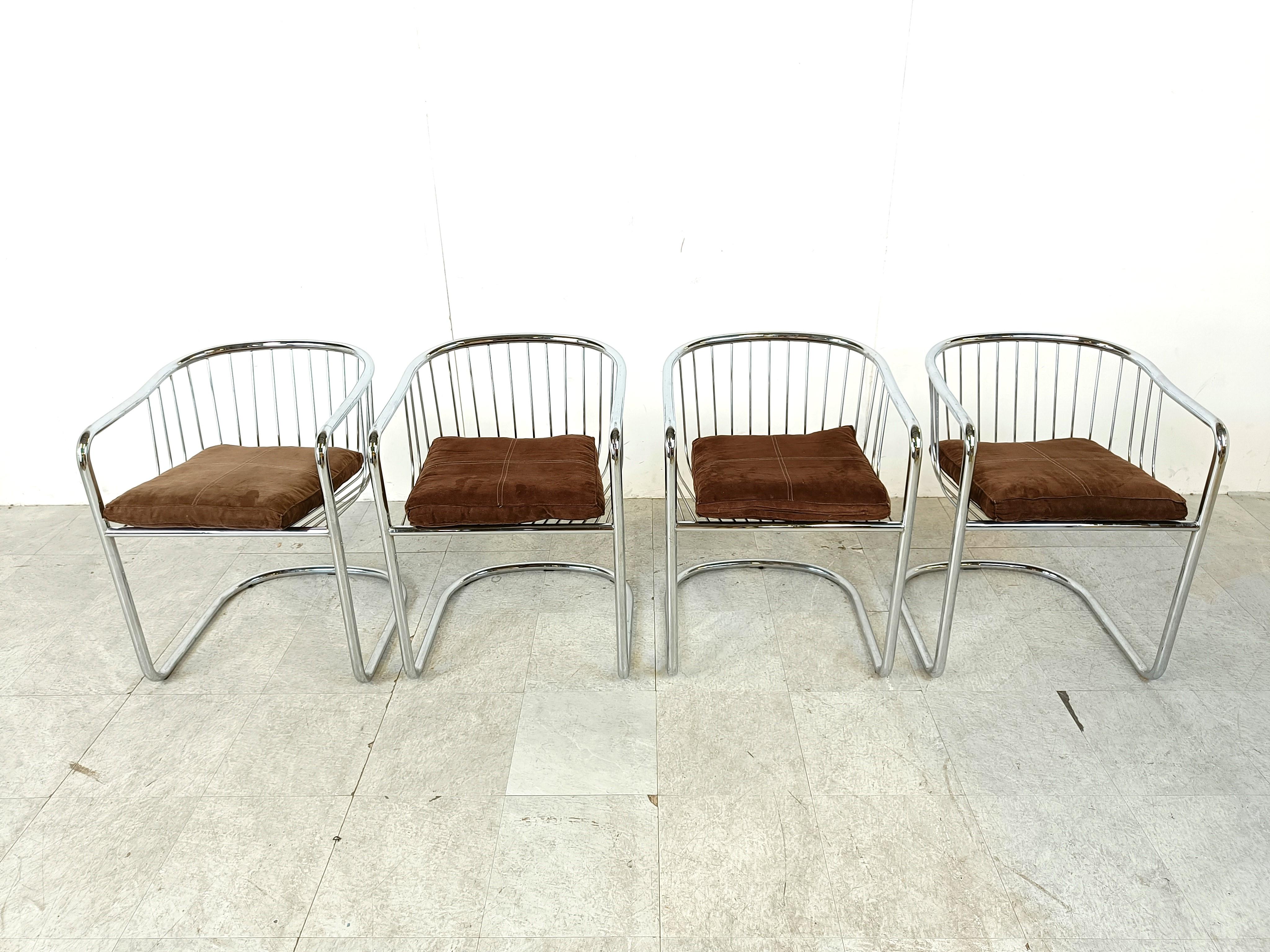 Seventies chromed tubular and chrome wire metal dining chairs with a cantilever base.

These German made dining chairs are often attributed to Gastone Rinaldi.

The cantilever design and the use of tubular chrome dates back to the 1920s - Bauhaus