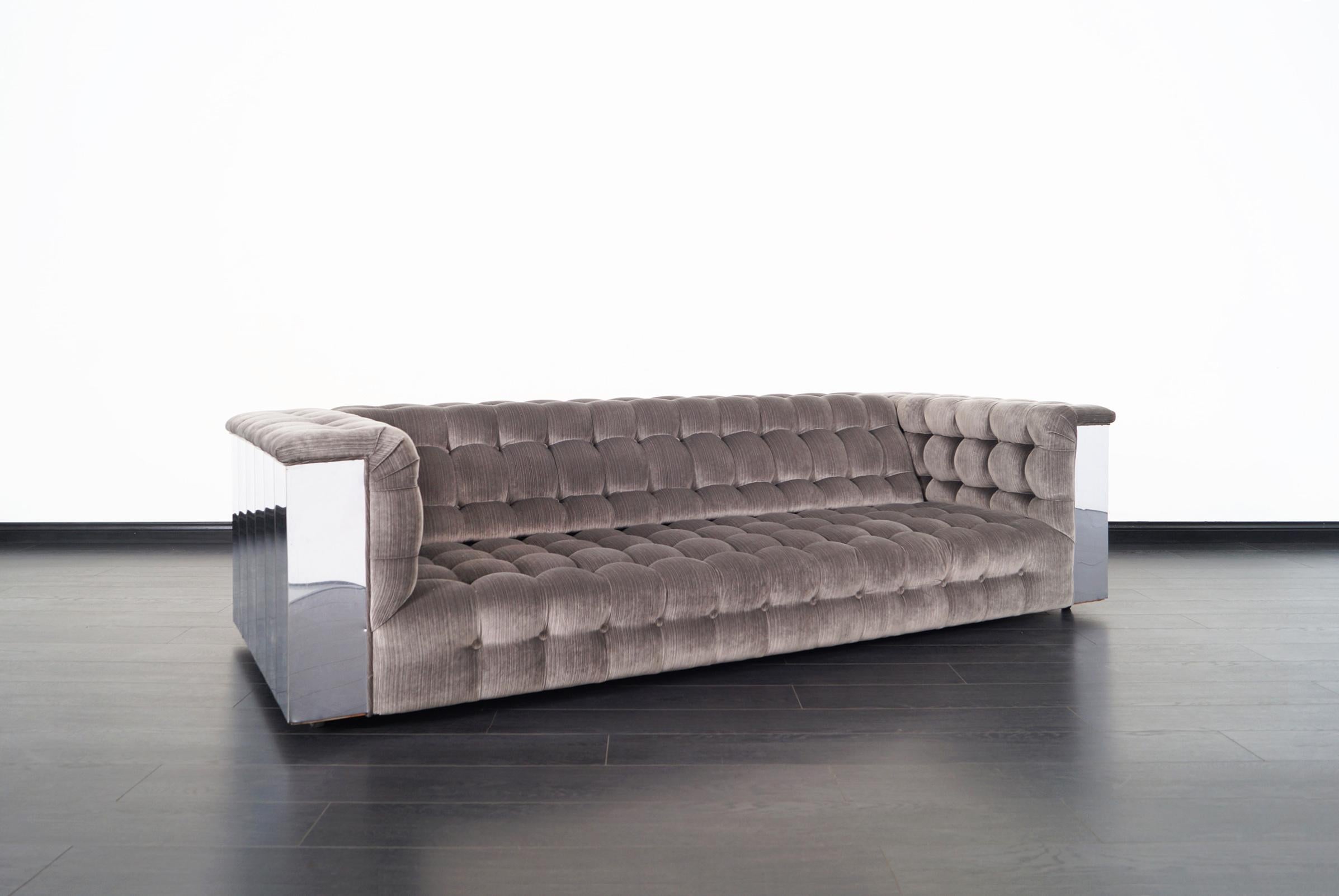 Amazing vintage chrome “Cityscape” sofa in the manner of Paul Evans and manufactured in the United States, circa 1960s. Features an exceptional design where the chrome frame that surrounds the sofa stands out, which causes the reflection of the