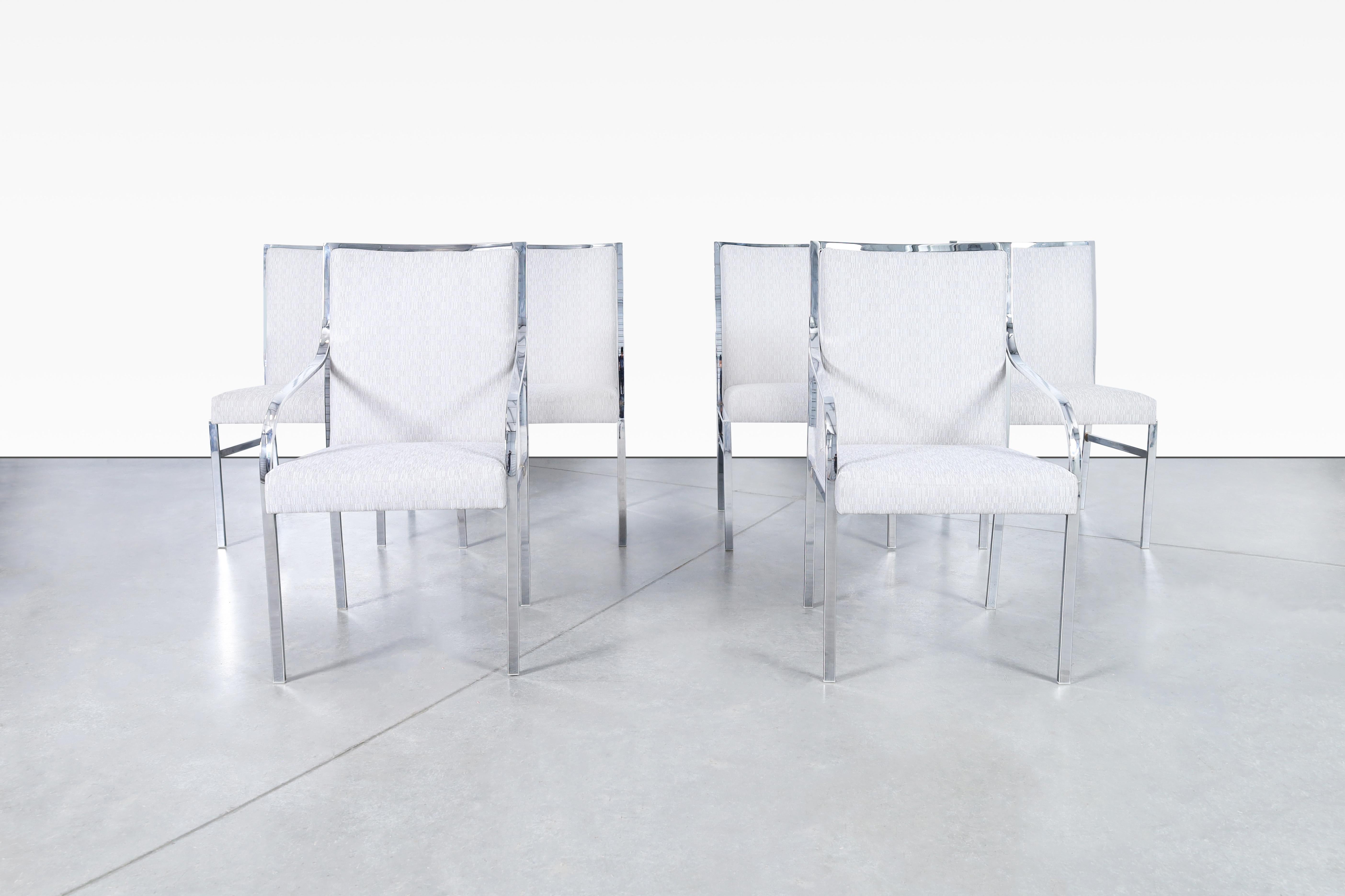 Gorgeous vintage chrome dining chairs designed by Pierre Cardin for Dillingham in the United States, circa 1970s. Bring a modern and sophisticated feel to your dining area with these exquisite chairs. Featuring a newly upholstered seat paired with