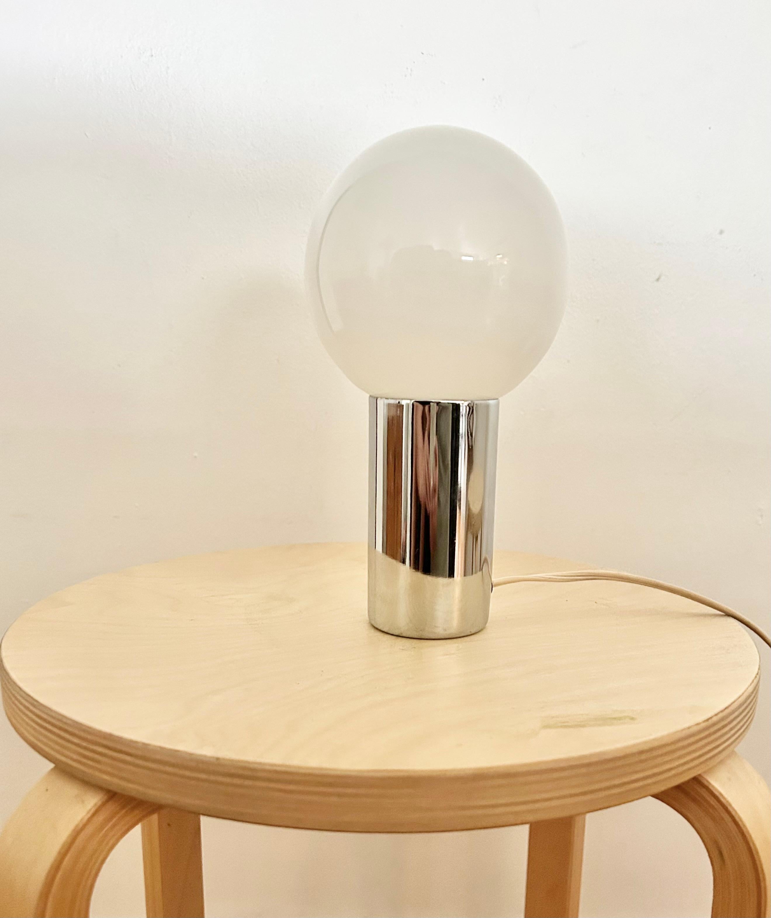 Vintage 1970s chrome lamp by Heyco. Glass globe covers bulb inside chrome base. Globe sits on hollow silver chrome base. Minimal wear no chips or scratches. 

8.5” height
4.5” globe diameter

