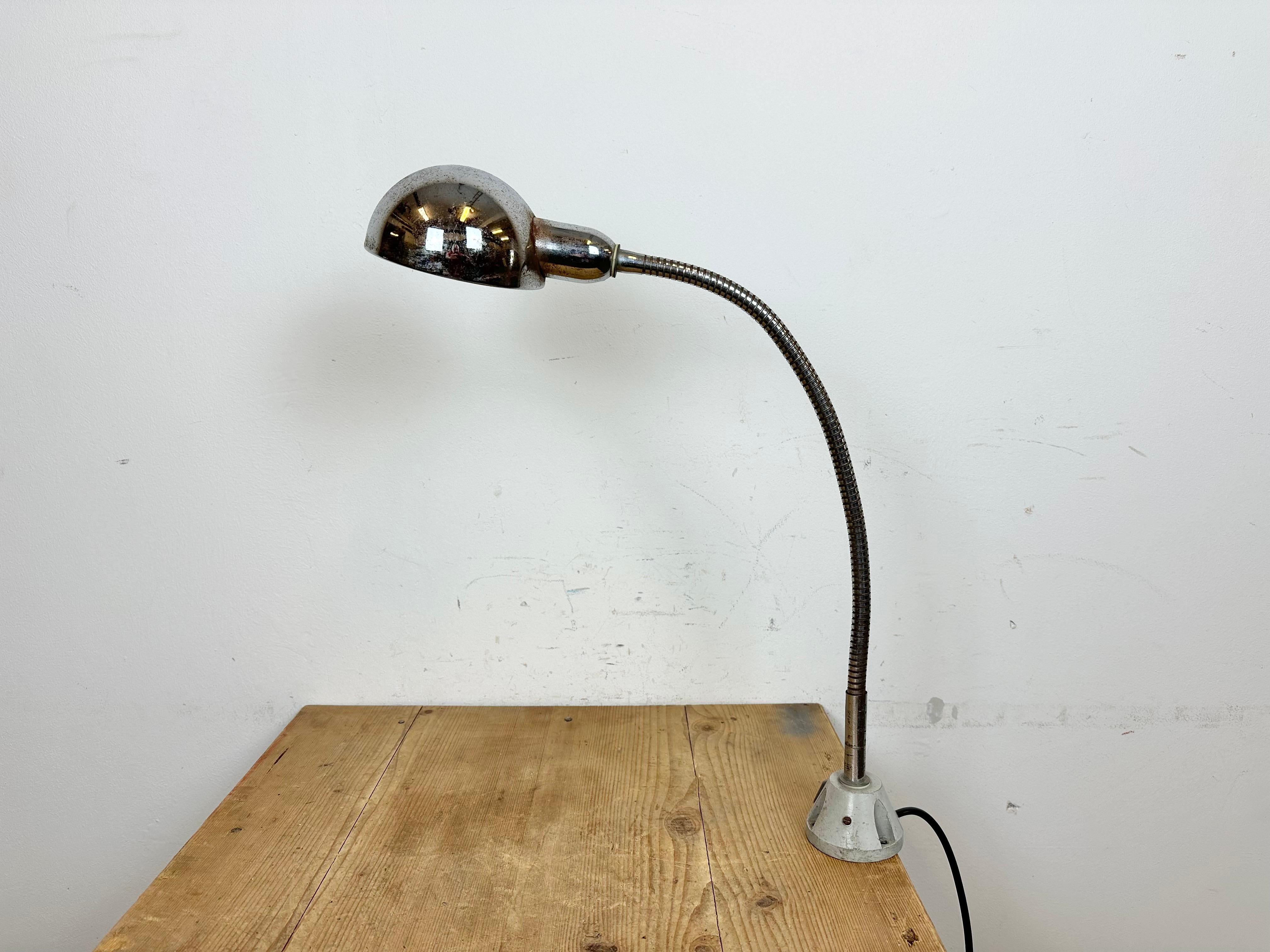 Industrial chrome flexible gooseneck table lamp  made in Italy during the 1960s. Original vintage condition. The socket requires  standard E 27/E 26 light bulbs. New wire The lampshade diameter is 13 cm. The weight of the lamp is 1 kg.