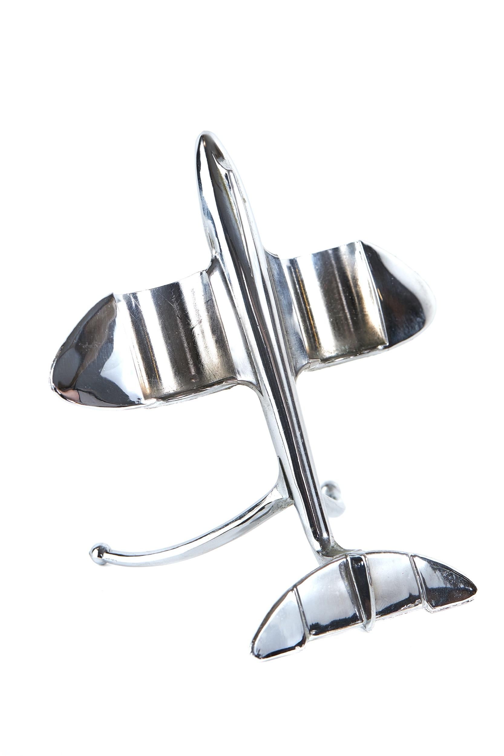 Vintage Chrome Jet plane Cruet set 
circa 1950
Chrome plated body , 
the wings shaped to hold Salt & Pepper pot , in form of the Jet engines, 
pots with pierced outer case detail. 
Bristol Blue glass linings, 
[no splits in top rims]
under plane