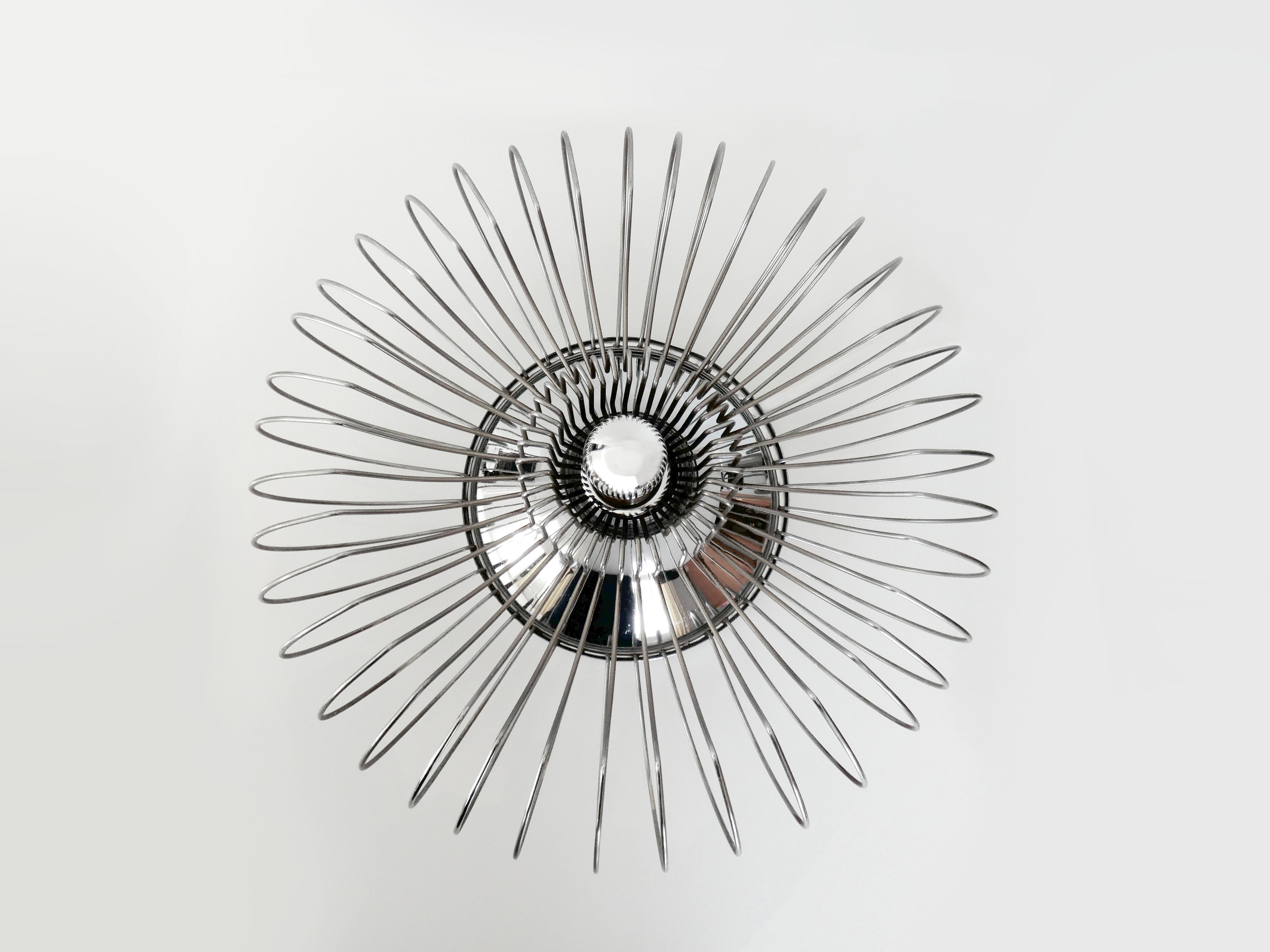 This striking ceiling light, flush mount lamp, or versatile table lamp, sometimes referred to as a 