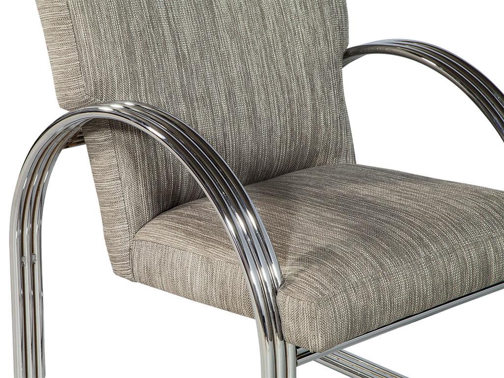 Vintage Chrome Lounge Chair by Milo Baughman. This armchair features a curved metallic frame coupled with earthy fabric cushioning. The original frame in polished chrome brings a whole new level of class. The angle of the backrest is carefully