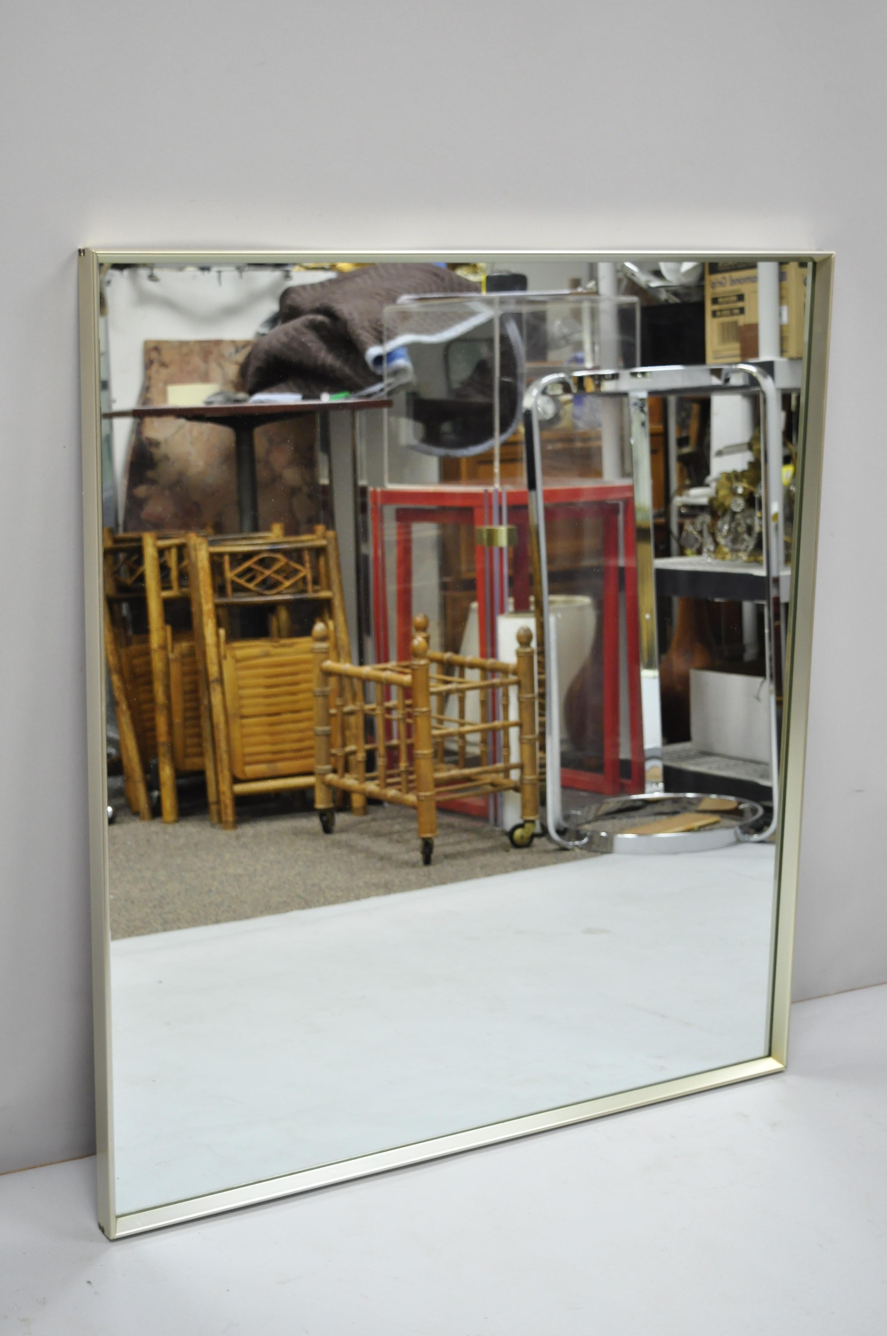 Vintage metal frame Mid-Century Modern Modernist dresser wall mirror by Hart Mirror Plate Co. Item features a deep metal frame, original label, clean modernist lines, quality American craftsmanship, circa mid-20th century. Measurements: 41