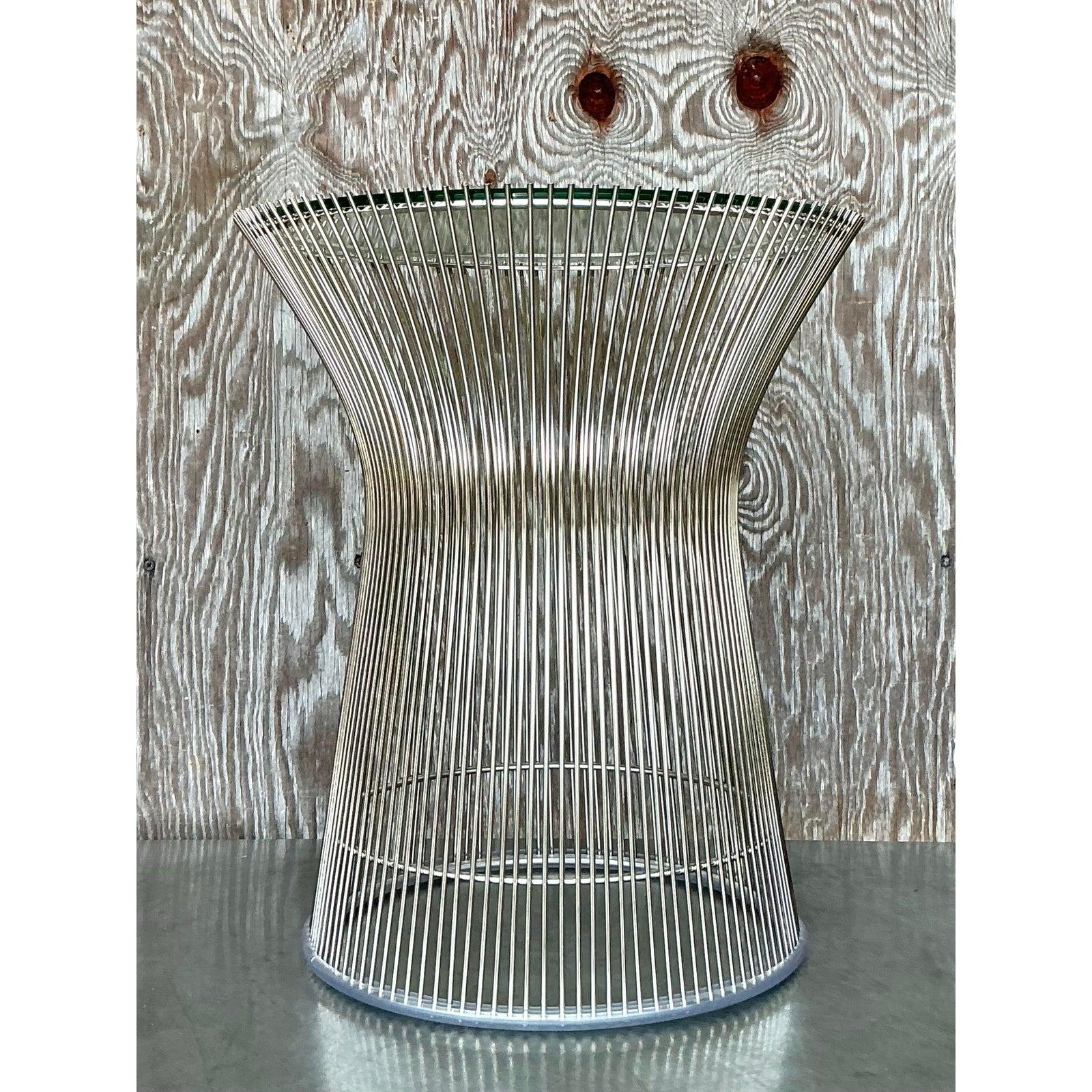 This stunning Mid-Century Modern side table is a timeless piece inspired by Warren Platner’s iconic design. Featuring an elegant chrome wire base with a sculptural hourglass silhouette, this table exemplifies sleek sophistication. The transparent