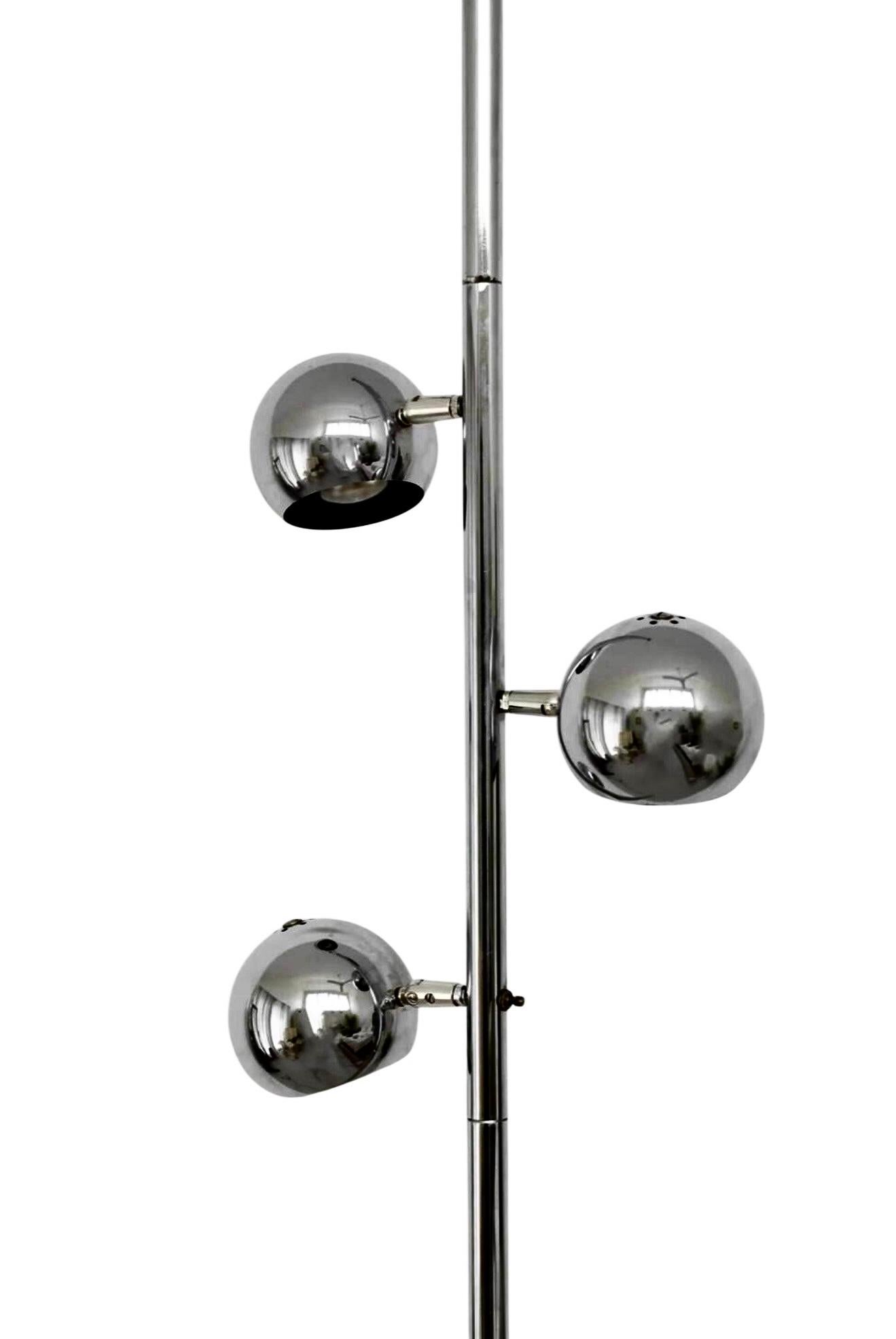 Step into the future of mid-century design with this stunning Vintage Chrome Space Age Tension Pole Lamp. With its sleek lines, reflective chrome finish, and futuristic aesthetic, this lamp is a quintessential example of the Space Age style that