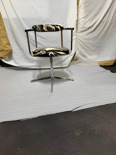 Mid Century chrome swivel base chair w/ abstract fabric