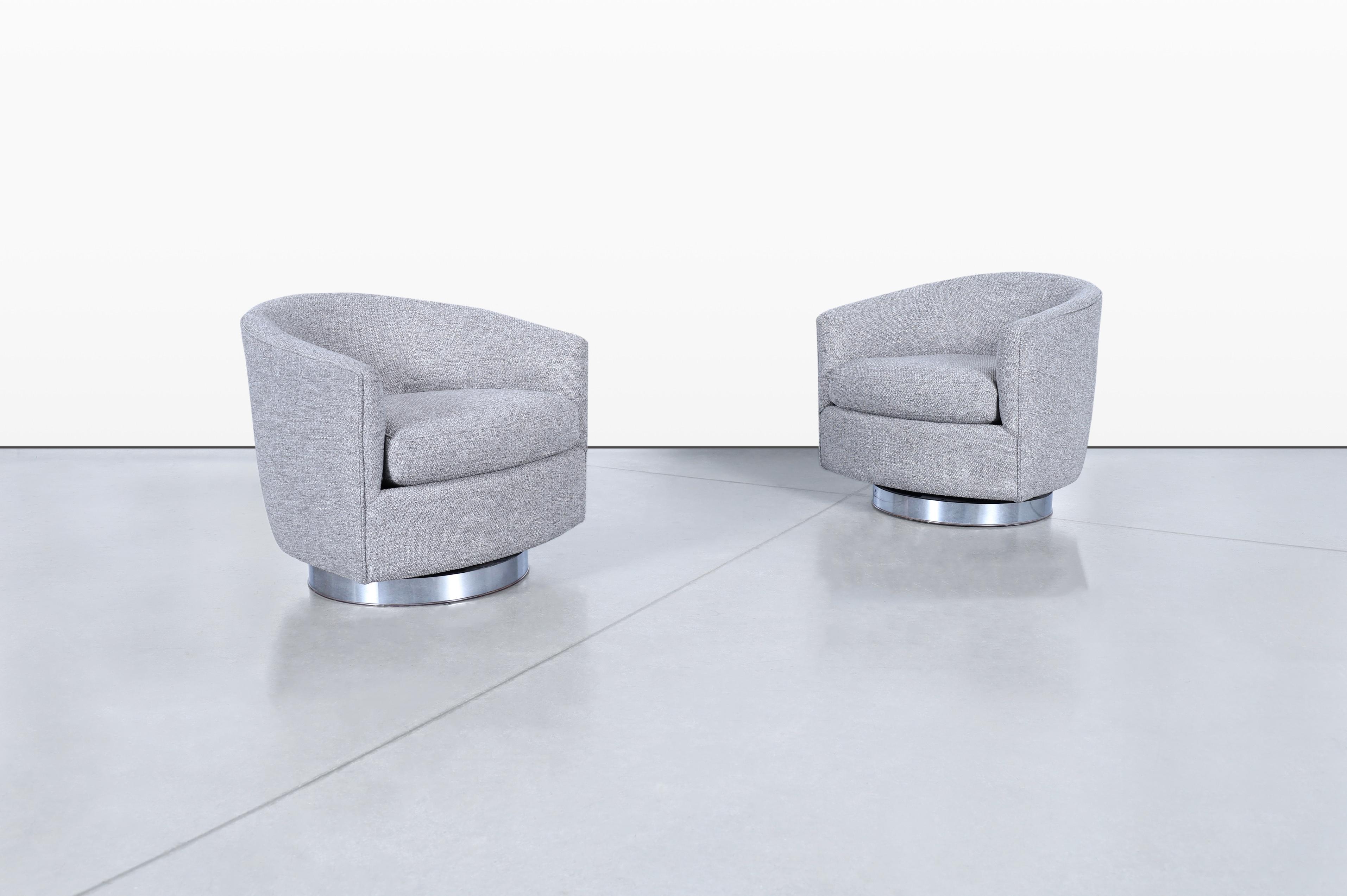 Introducing a pair of stunning vintage chrome swivel lounge chairs, expertly designed by Milo Baughman for Thayer Coggin in the iconic 1970s. These chairs exhibit a captivating circular design on the backrest, complemented by well-defined lines that